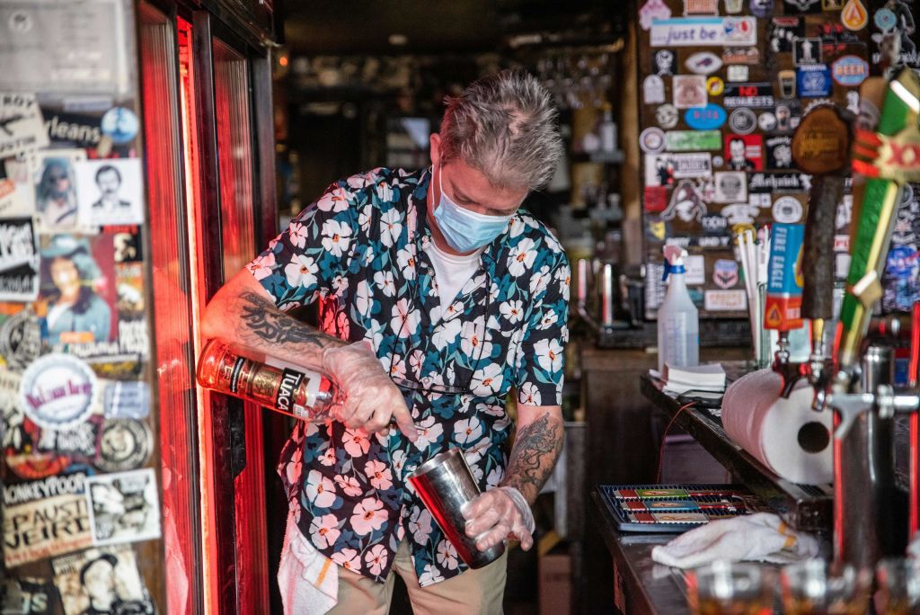 A bartender wearing a facemask makes a drink at a restaurant in Austin, Texas, June 26, 2020. (Sergio Flores—AFP/Getty Images)