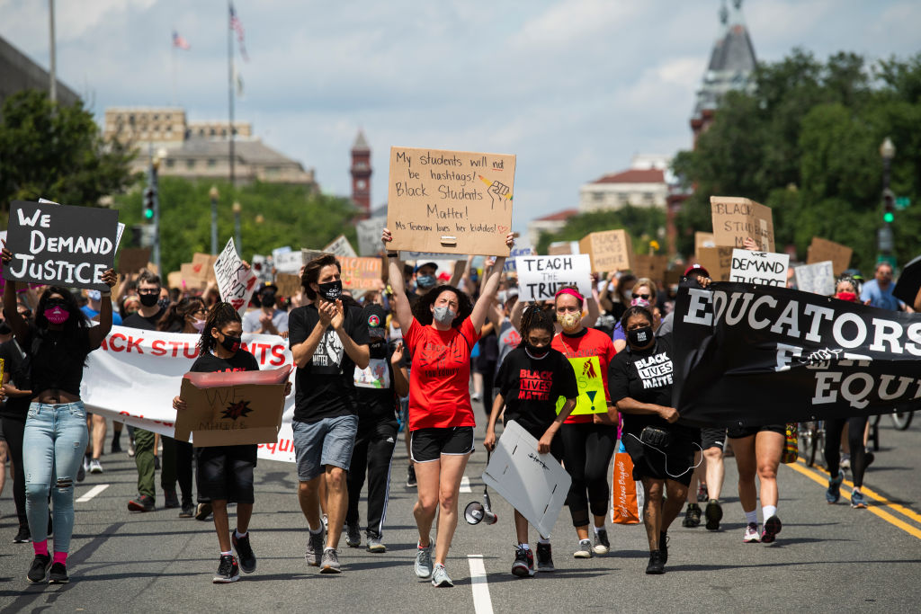 Demonstrators march towards the U.S. Department of Education as part of the Black Students Matter rally, which was organized by Educators for Equity on June 19, 2020, in Washington, D.C. (Matt McClain/The Washington Post—Getty Images)