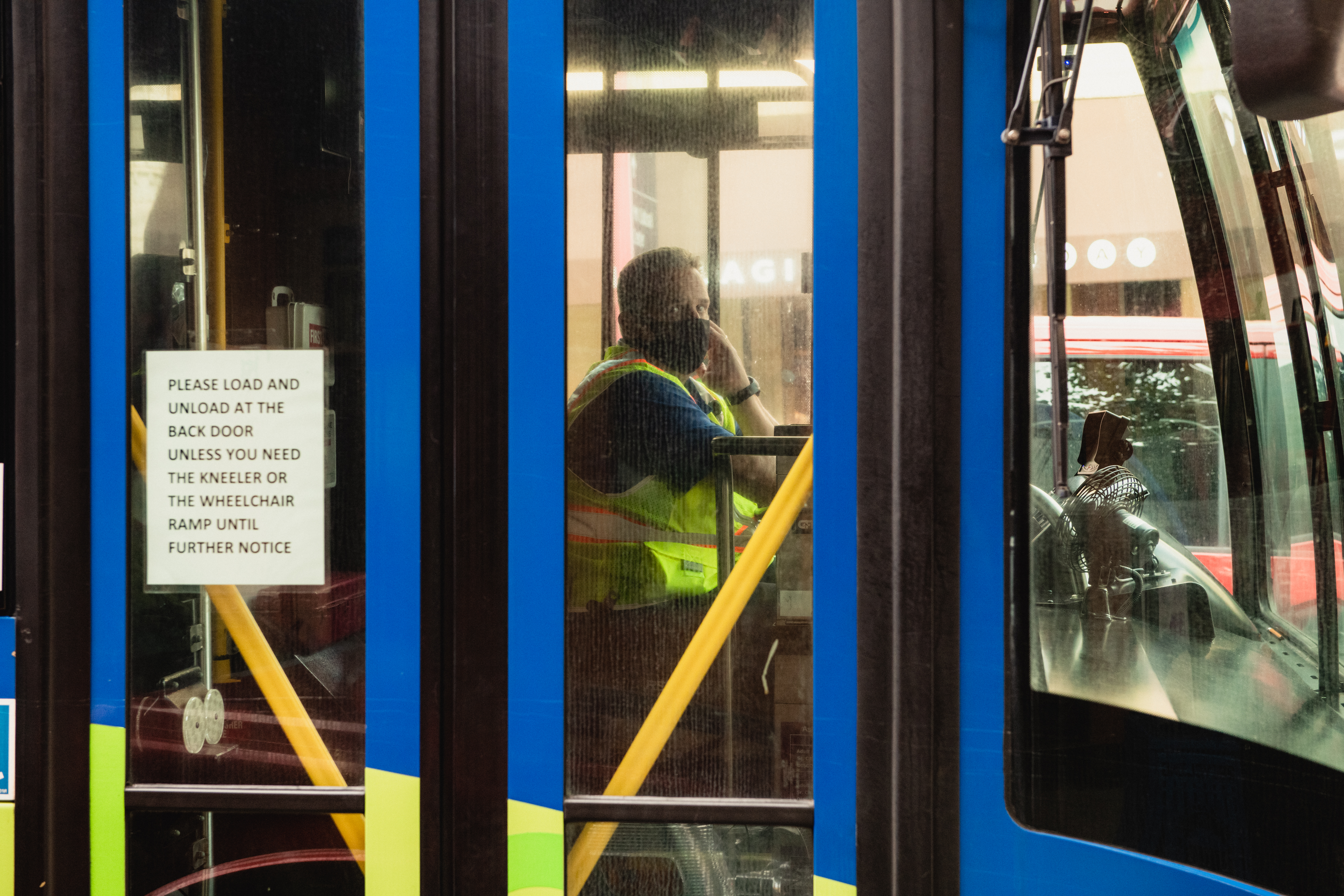 A driver wears a protective mask while riding a bus in downtown Asheville, North Carolina, U.S., on Wednesday, July 15, 2020. (George Etheredge—Bloomberg/Getty Images)