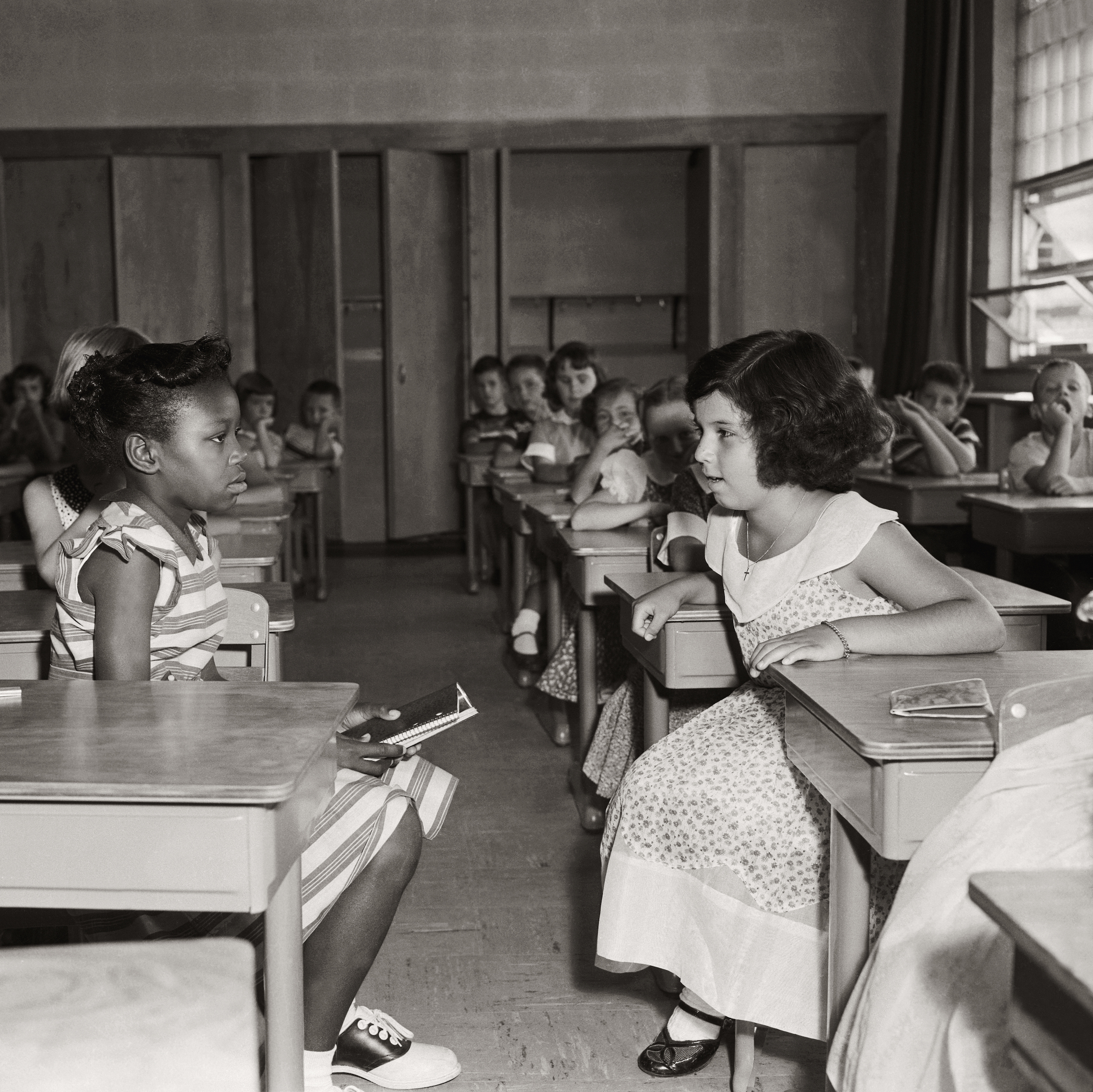 Two students in Fort Myer Elementary School face each other on the first day of desegregation in 1954. (Bettmann Archive)