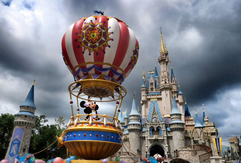 Mickey and Minnie appear under stormy skies during the afternoon parade, shortly before the Magic Kingdom at Walt Disney World in Lake Buena Vista, Fla., closed early due to weather spawned by Hurricane Dorian, Tuesday, Sept. 3, 2019. (Joe Burbank—Orlando Sentinel/Tribune News Service/Getty Images)