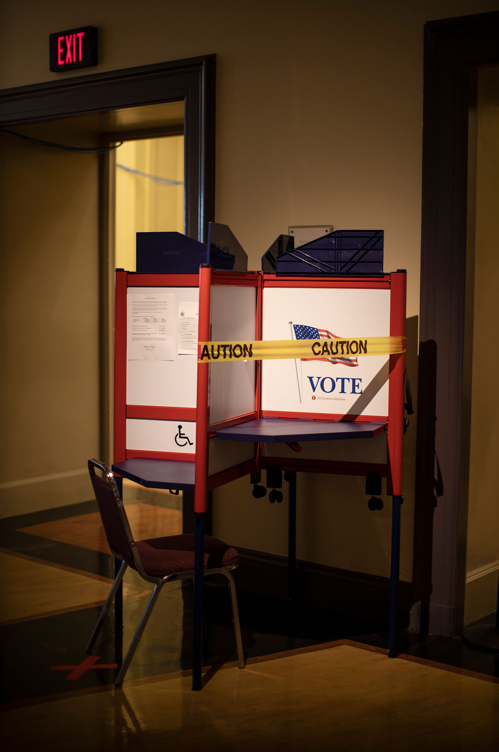 A voting booth is taped off to ensure social distancing during in-person absentee voting in Portland on June 23, 2020.
