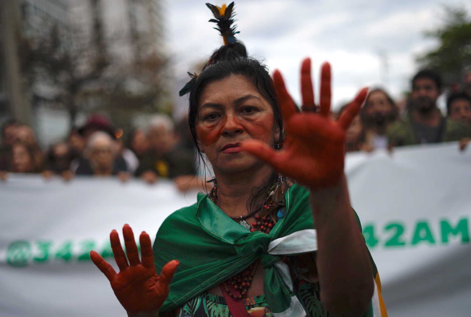An activist takes part in a protest against the destruction of the Amazon rainforest, at Ipanema Beach in Rio de Janeiro, Brazil, on Aug. 25, 2019. (Mauro Pimentel—AFP/Getty Images)