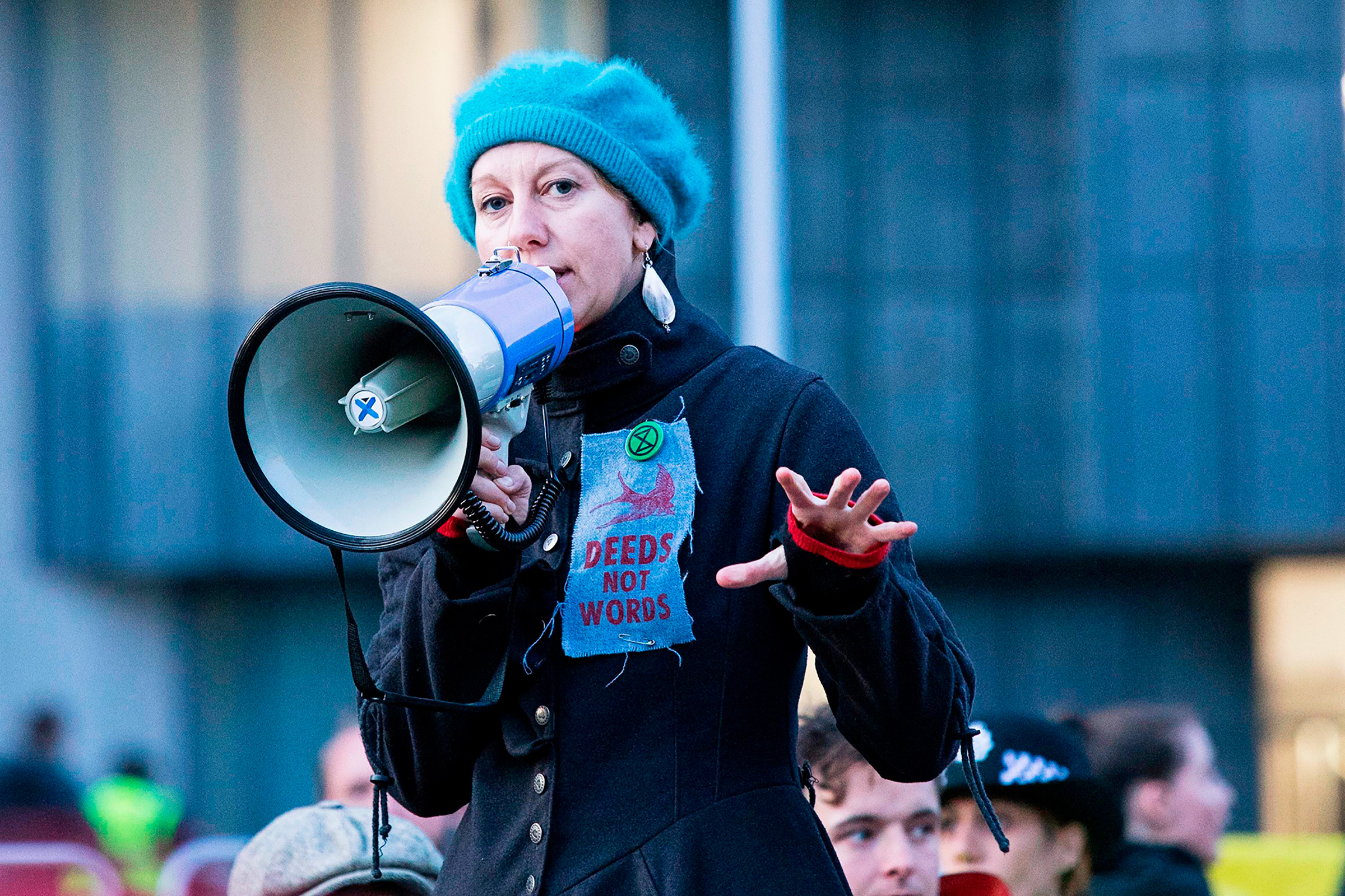 Co-founder Gail Bradbrook speaks to activists blocking a road in Central London on Oct. 9. (George Cracknell Wright—LNP/Shutterstock)