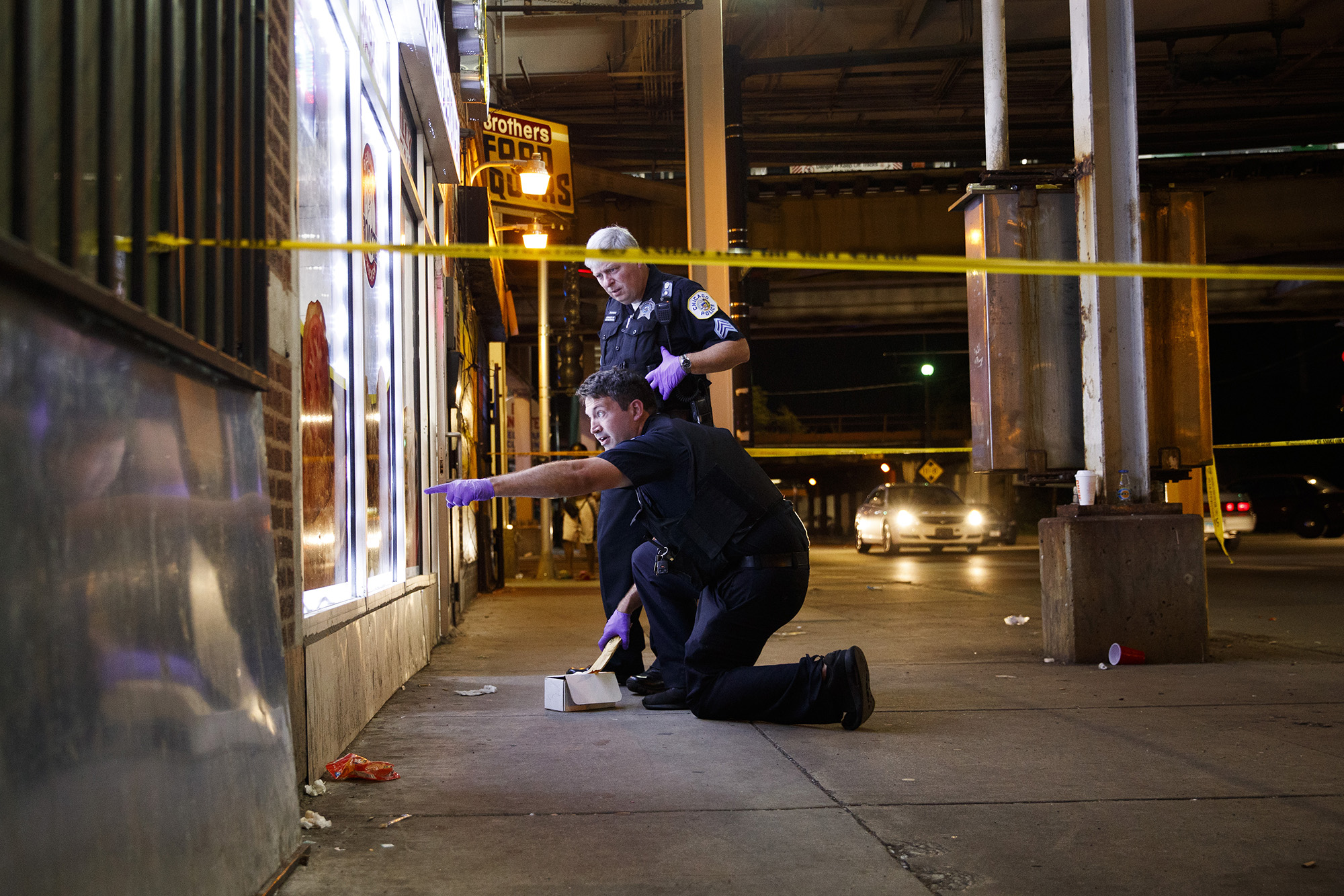 Police work a scene where two people were shot, one fatally, near the intersection of North Laramie Avenue and West Lake Street in Chicago on July 5, 2019. (Armando L. Sanchez—Chicago Tribune/Getty Images)
