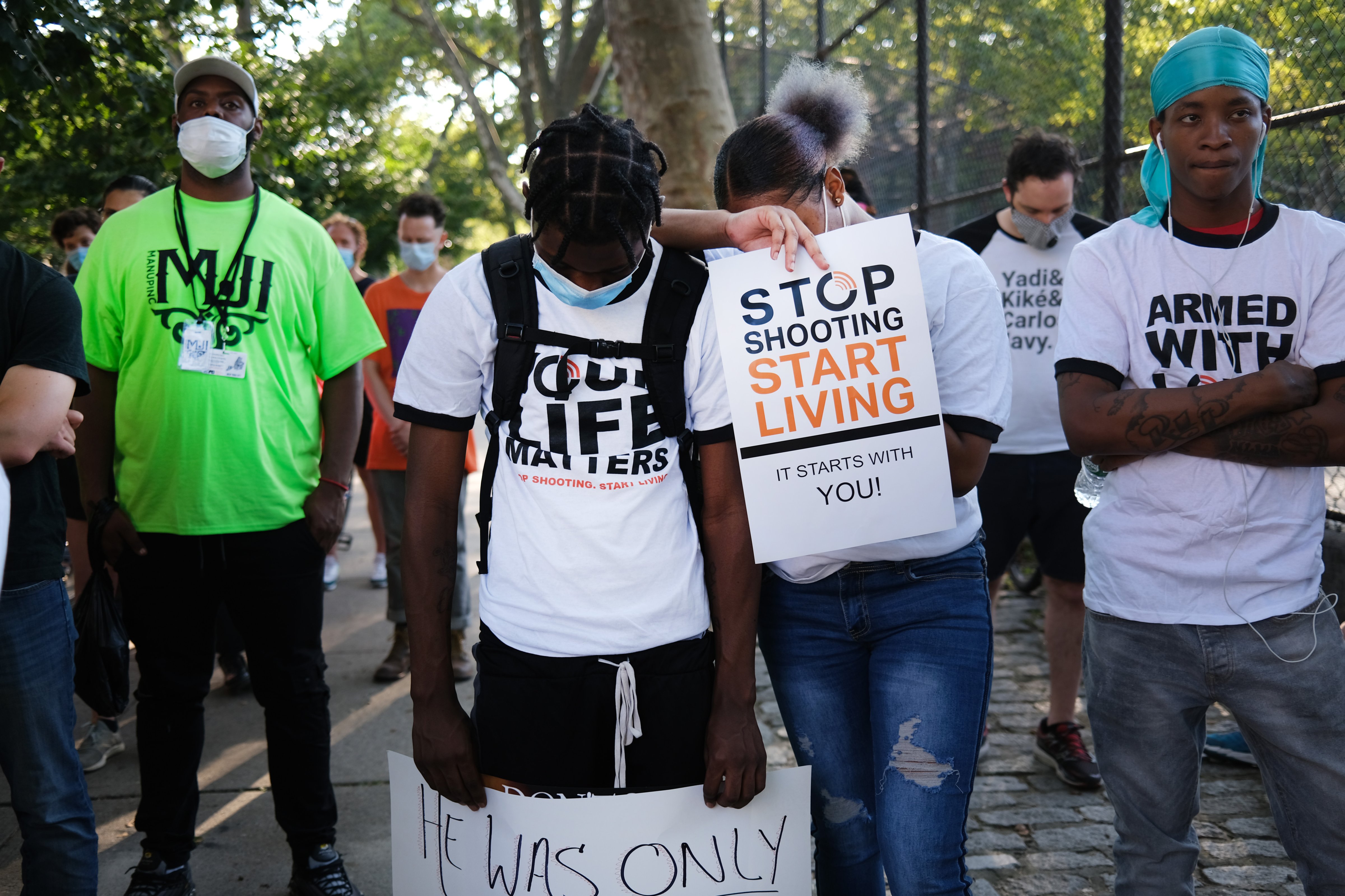 The group Save Our Streets (S.O.S.) holds a peace march in response to a surge in shootings in Brooklyn, New York on July 16, 2020. The march was held near the scene where a one-year-old child was recently shot and killed. (Spencer Platt—Getty Images)