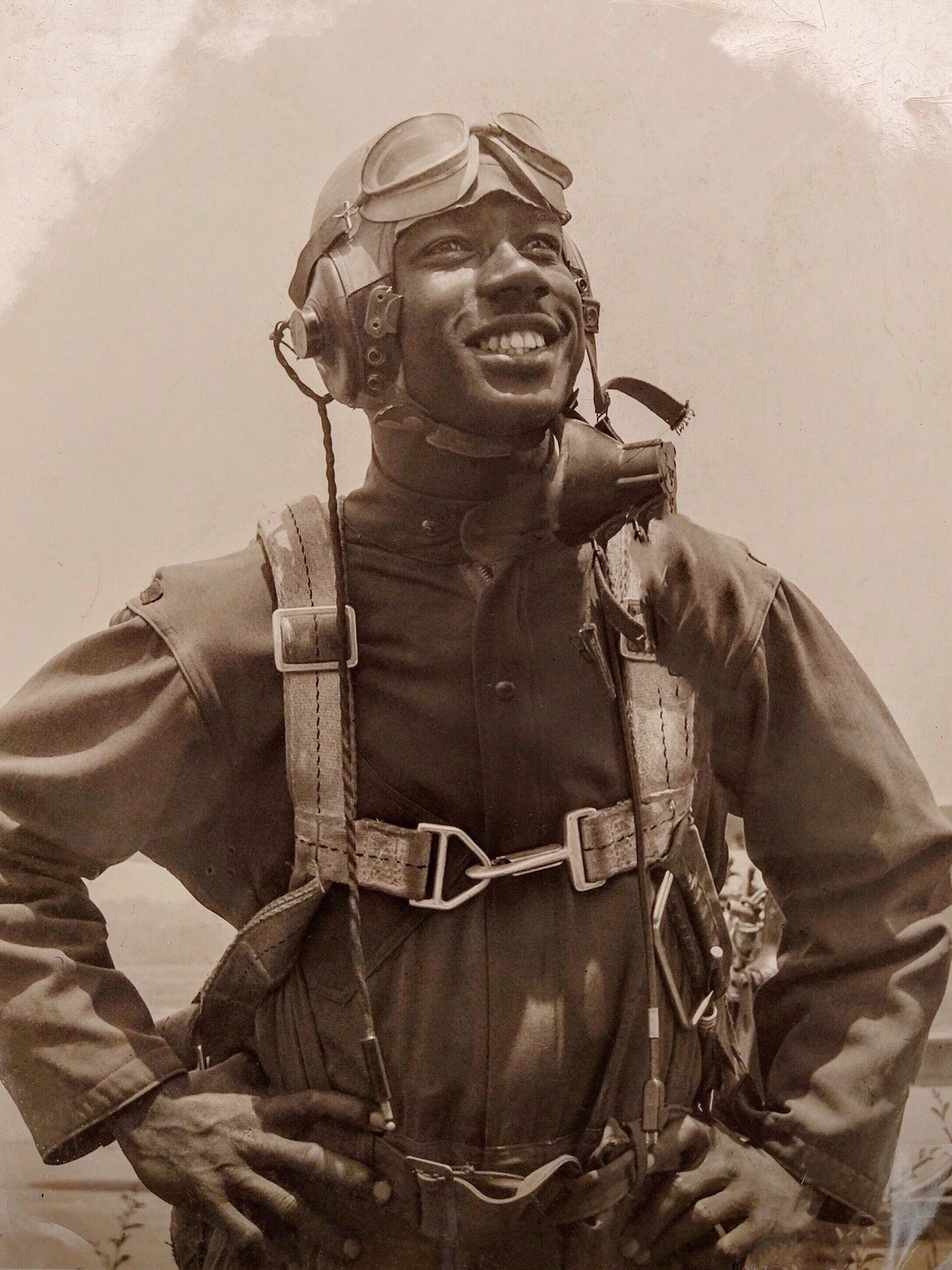 Wilkerson displays a photo in her home of her father in his Tuskegee Airmen uniform