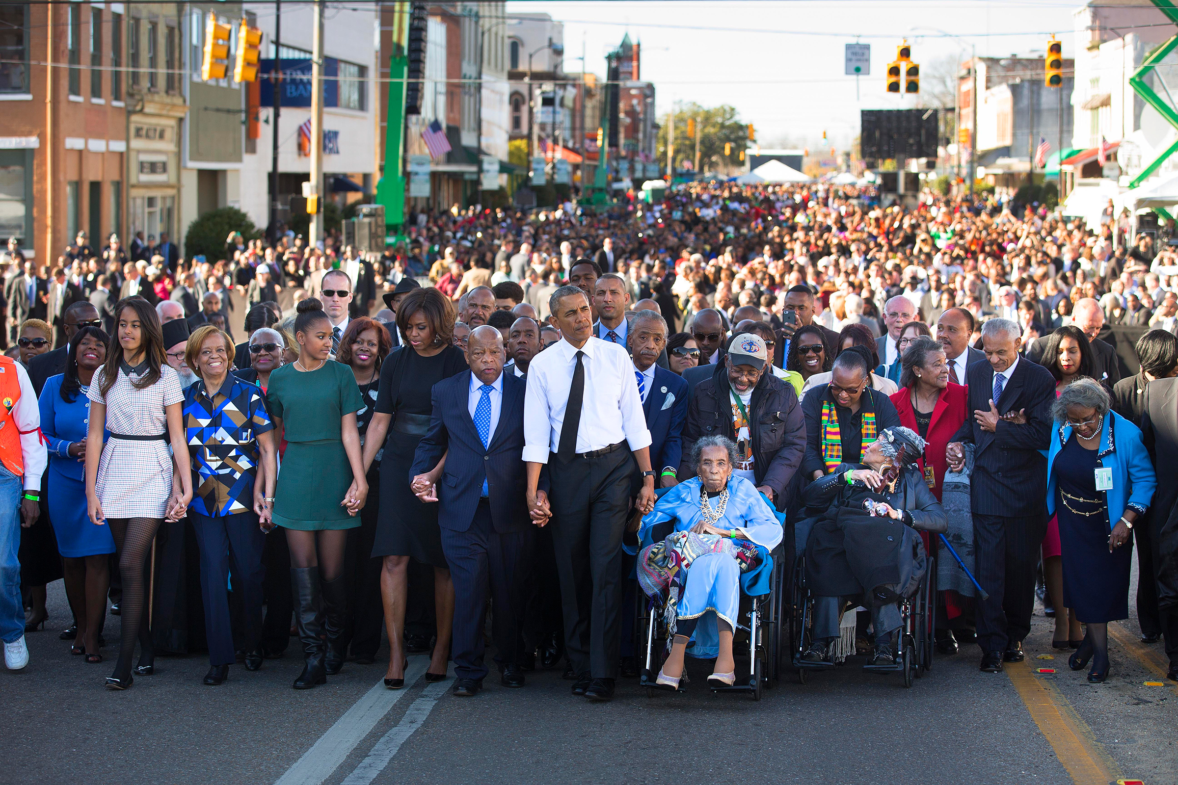 Barack Obama, Amelia Boynton, right, Rep. John Lewis and the President's family lead a march toward the Edmund Pettus Bridge in Selma, Ala., on March 7, 2015, 50 years after "Bloody Sunday."