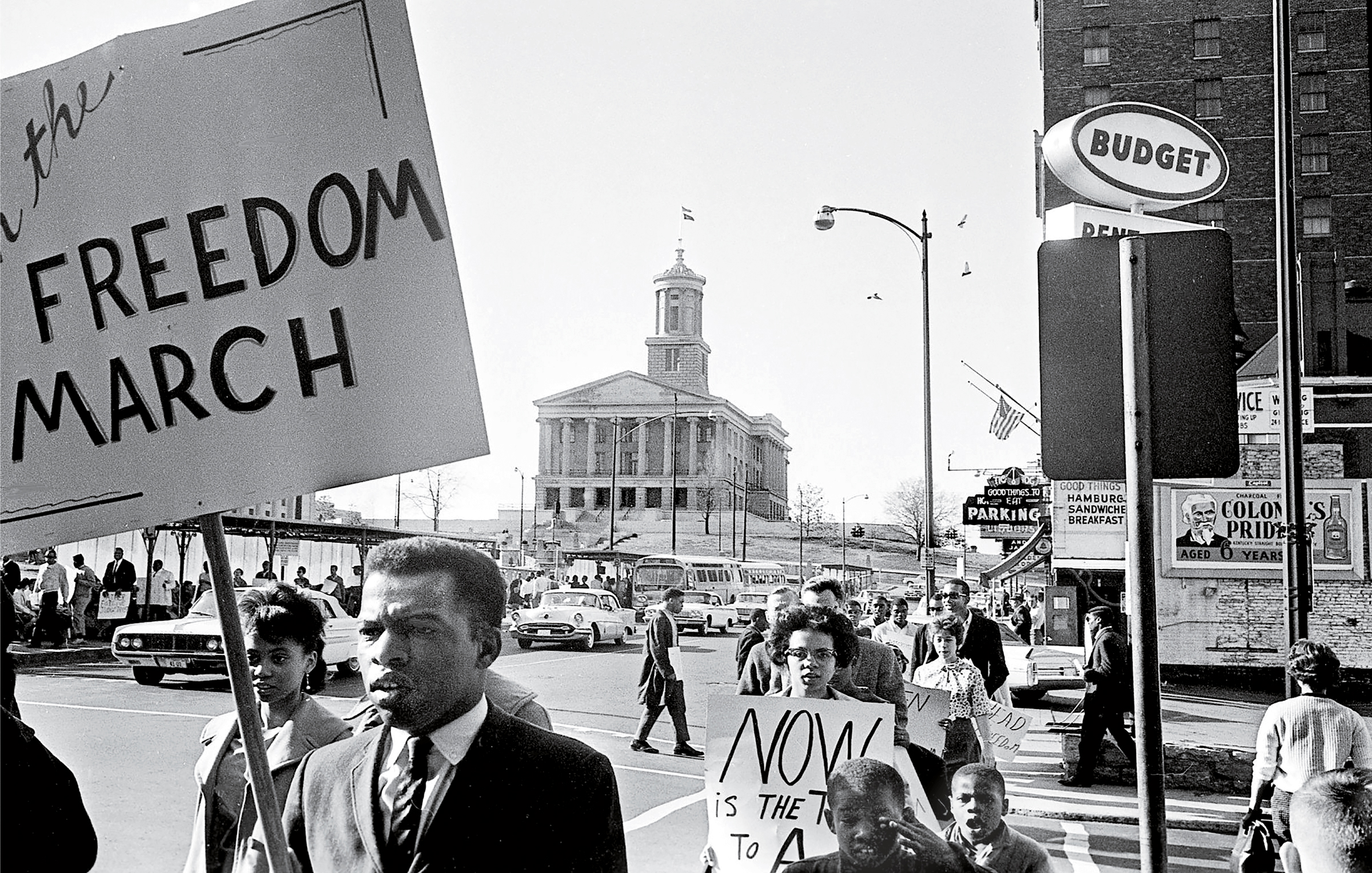 John Lewis, in the foreground holding a sign, demonstrates in downtown Nashville on March 23, 1963. (Frank Empson—The Tennessean/USA Today Network)