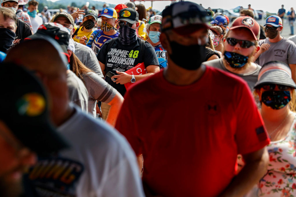 Fans wearing face masks and face coverings enter the race track prior to the NASCAR Cup Series All-Star Race at Bristol Motor Speedway on July 15, 2020 in Bristol, Tennessee. (Patrick Smith—Getty Images)