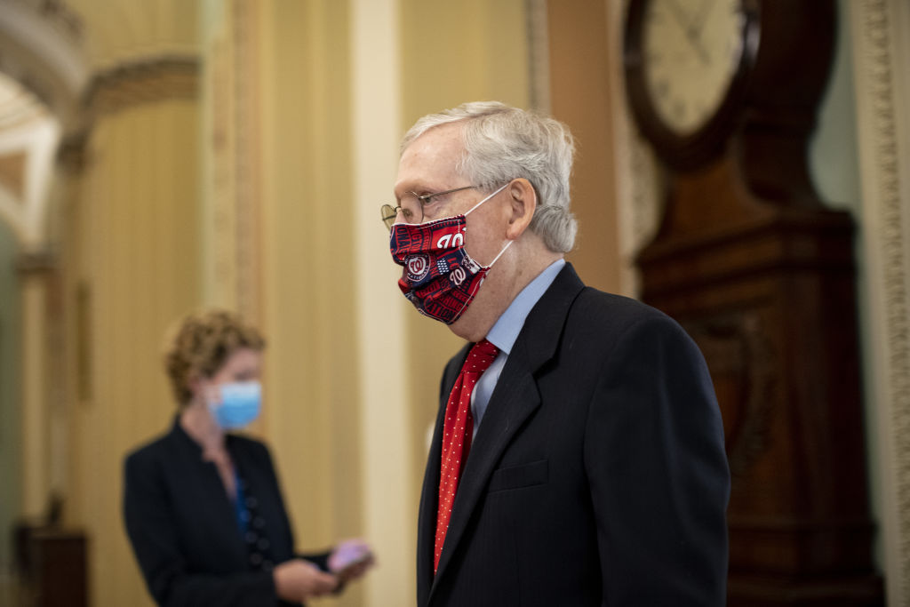 Senate Majority Leader Mitch McConnell, a Republican from Kentucky, wears a protective mask while walking to the Senate floor at the U.S. Capitol in Washington, D.C., U.S., on Thursday, July 30, 2020. (Al Drago–Bloomberg/Getty Images)