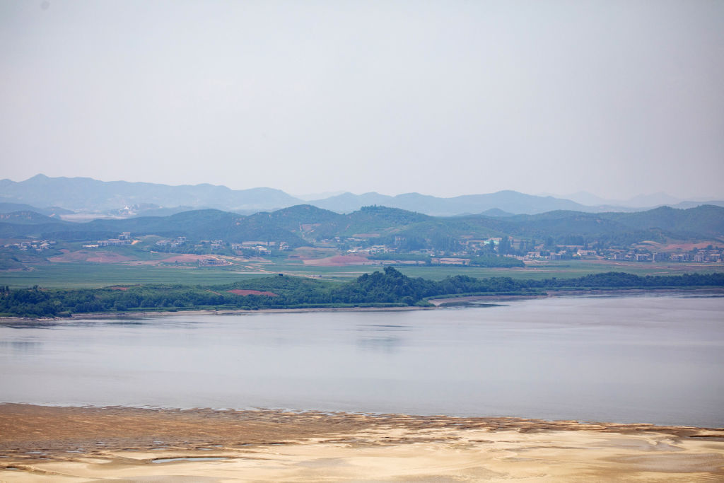 The North Korean village of Gaepung-Gun is seen from the Odusan Unification Observatory near the border in Paju, South Korea, on Wednesday, in Paju, South Korea, on Wednesday, June 17, 2020. North Korea said it would deploy troops into areas on its side of the border where it had joint projects with South Korea, further escalating tensions with its neighbor a day after destroying a liaison office the two once shared. (SeongJoon Cho–Bloomberg/Getty Images)