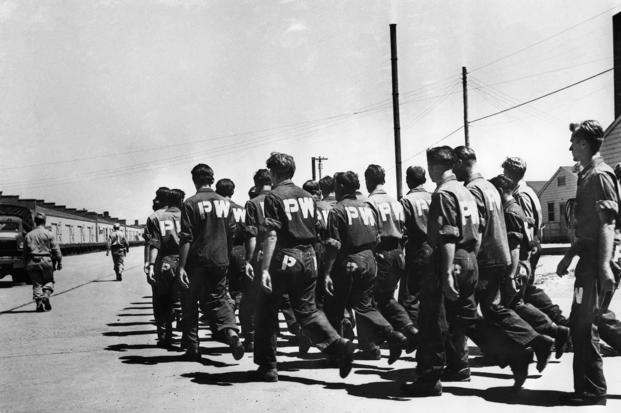 German prisoners at Camp Carson in Colorado sing as they march to the camp laundry in 1943 (Bettmann Archive/Getty Images)