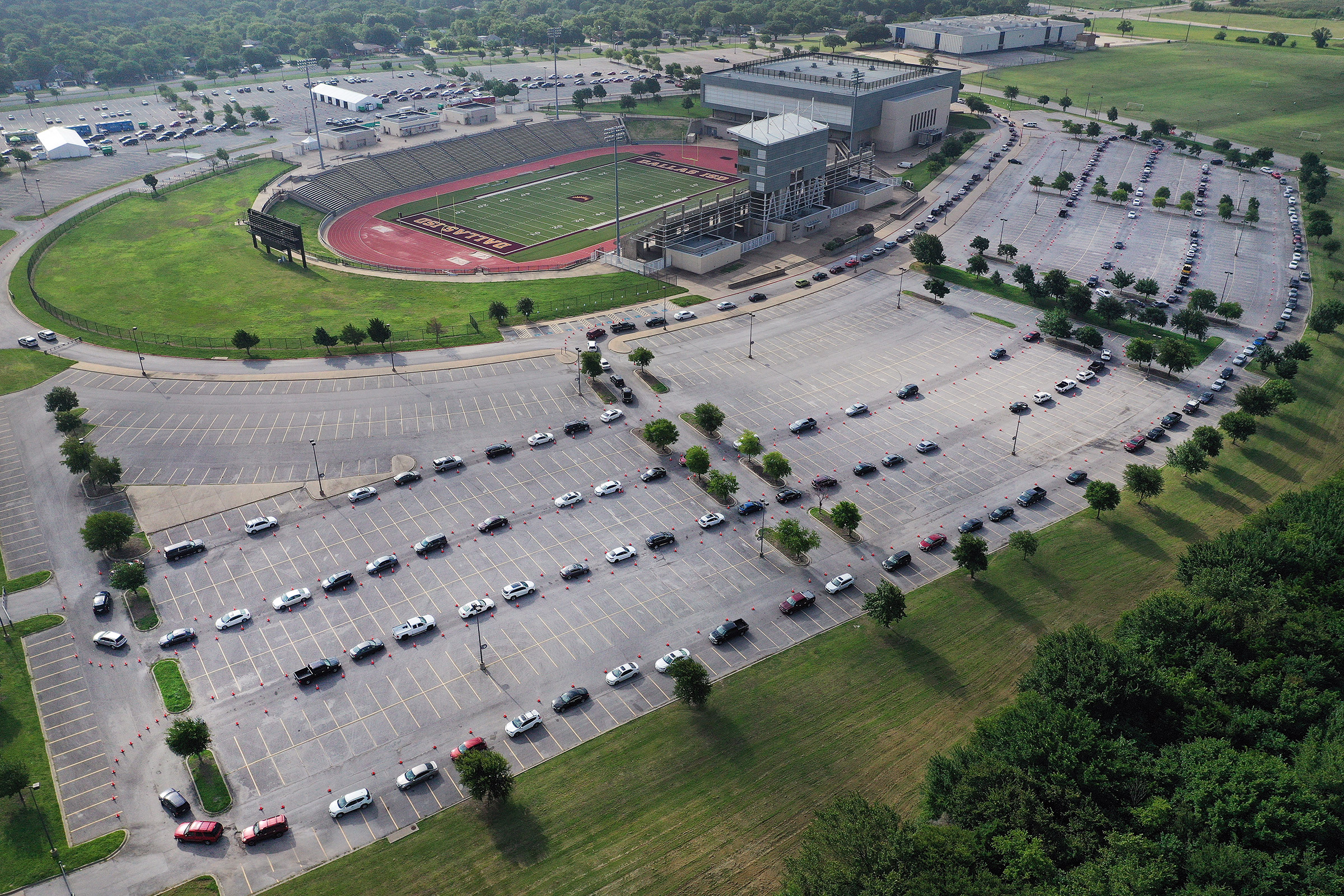An aerial view from a drone as residents wait in line for the drive-thru COVID-19 testing center at the Ellis Davis Field House on July 2 in Dallas