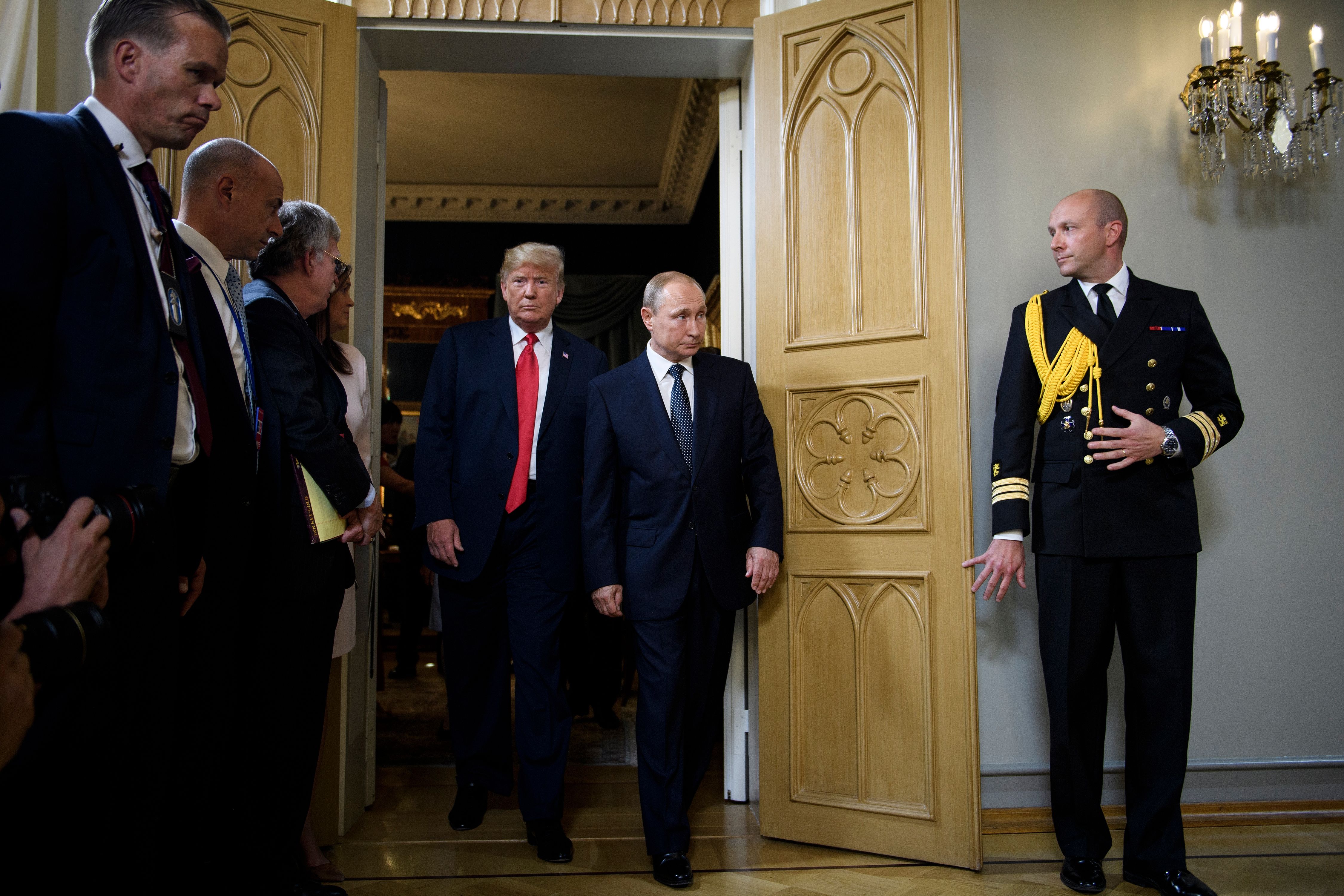 U.S. President Donald Trump and Russian President Vladimir Putin arrive for a meeting at Finland's Presidential Palace on July 16, 2018 in Helsinki, Finland. (Brendan Smialowski—AFP/Getty Images)