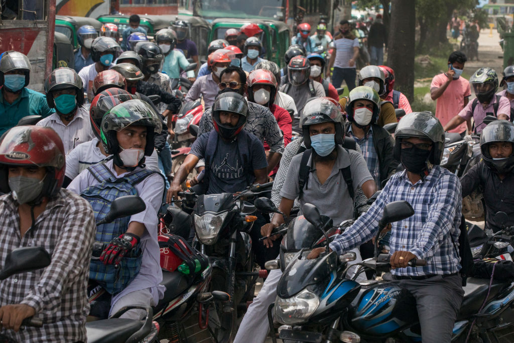 Motorbike drivers waiting in a traffic jam wear face masks as a preventive measure against the spread of coronavirus in Dhaka, Bangladesh on June 25, 2020. (Ahmed Salahuddin&mdash;NurPhoto/Getty Images)