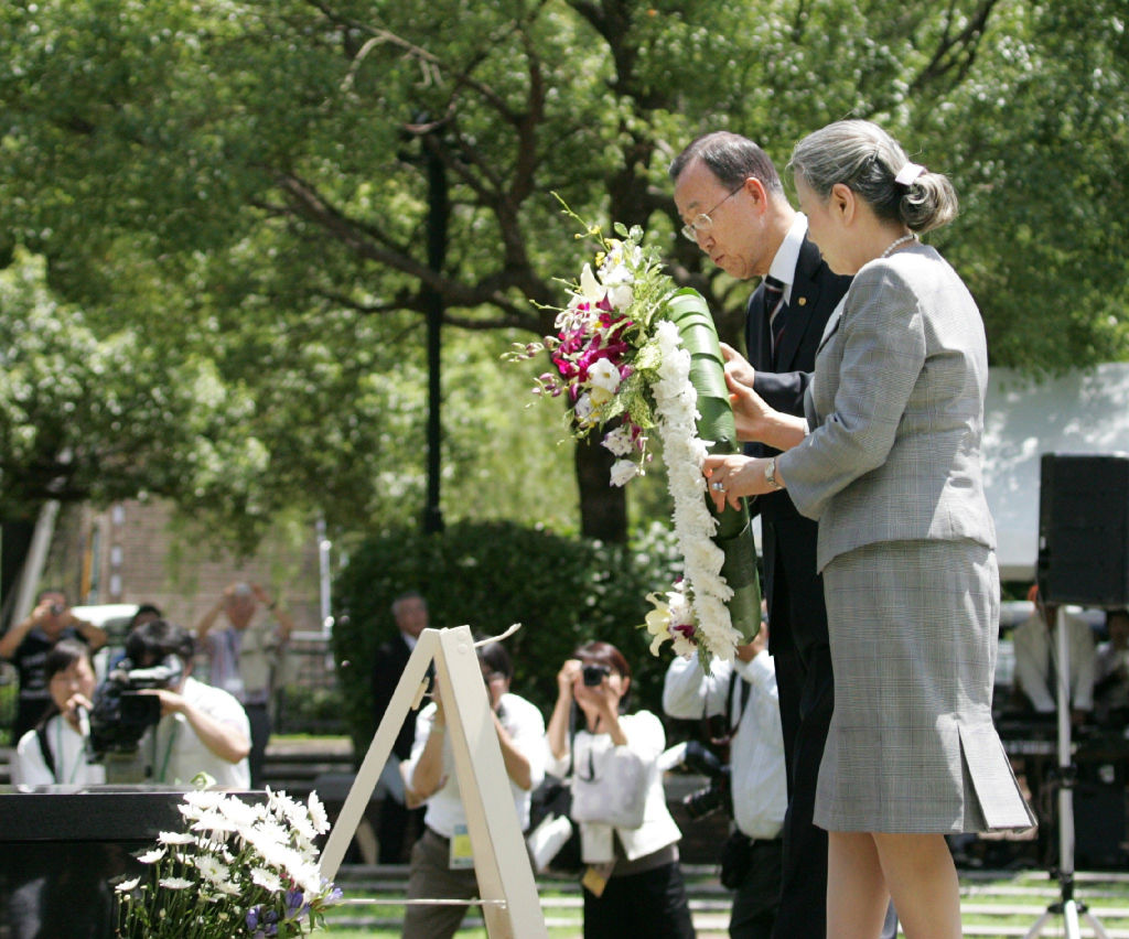 Ban Ki-moon (L) and his wife Yoo Soon-taek (R) lay a wreath at the monument of bombing centre in Peace Park in Nagasaki on Aug. 5, 2010, when Ban was United Nations Secretary-General (AFP via Getty Images)