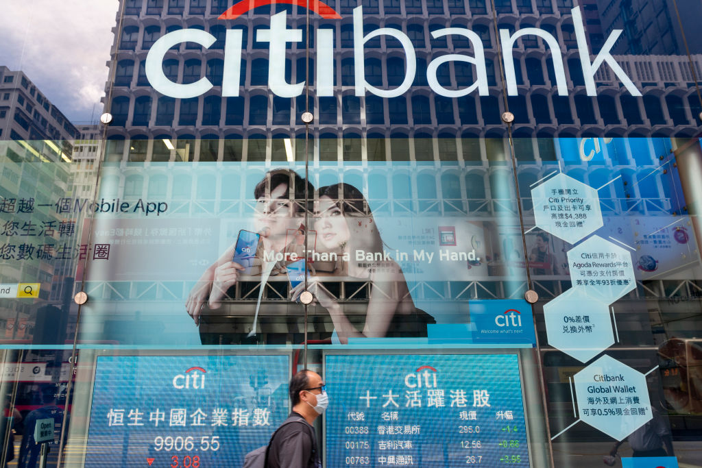 A pedestrian wearing a face mask walks past a branch of American multinational investment bank and financial services corporation Citibank in Hong Kong on July 7, 2020. (Photo by Budrul Chukrut/SOPA Images/LightRocket via Getty Images)