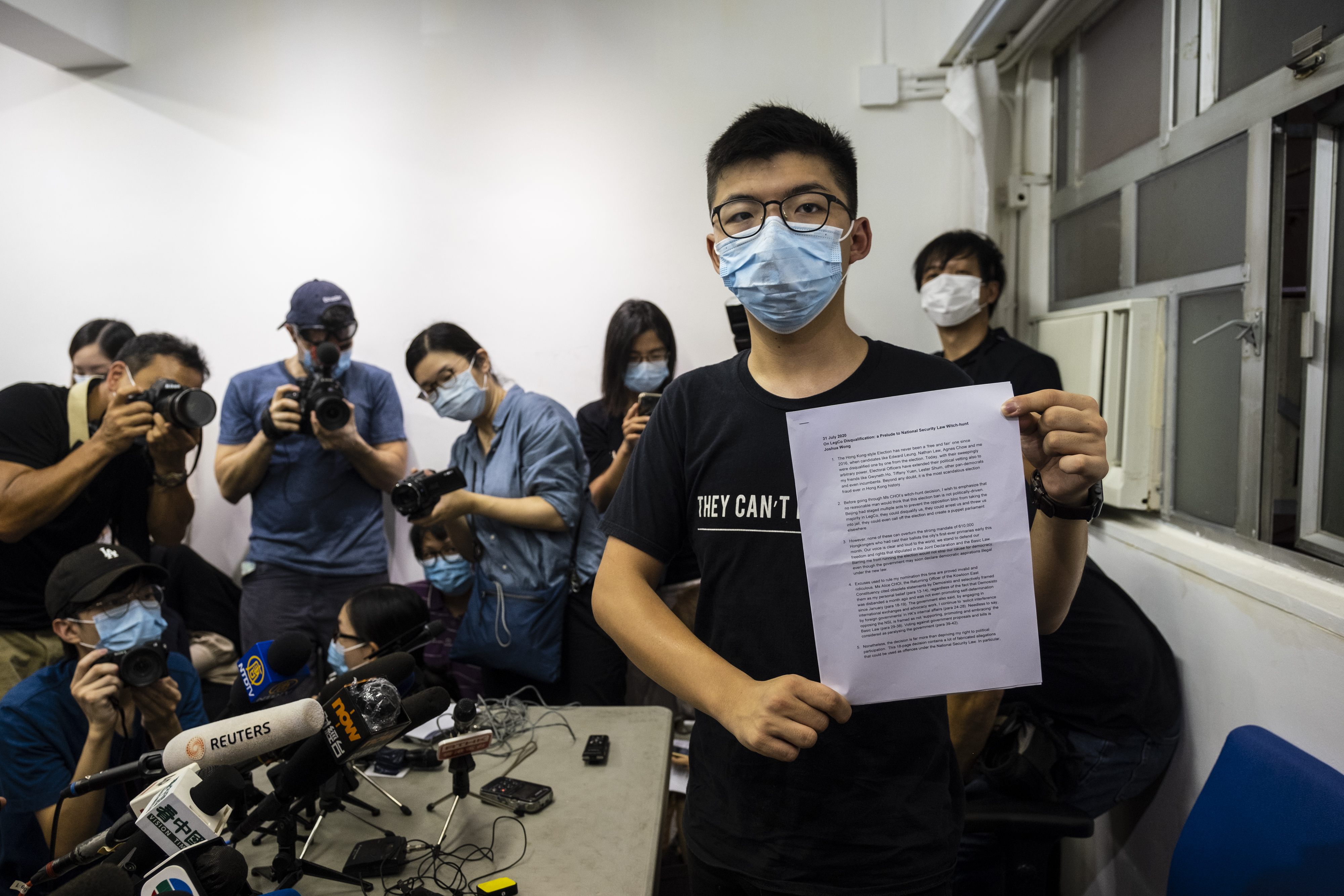 Joshua Wong, pro-democracy activist and disqualified candidate in the upcoming Legislative Council election, poses for a photograph with a copy of his prepared speech during a news conference in Hong Kong, China, on Friday, July 31, 2020. (Chan Long Hei/Bloomberg via Getty Images)