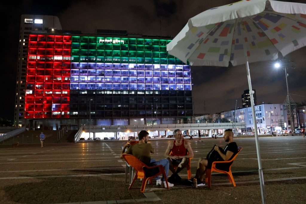 The city hall in the Israeli city of Tel Aviv is lit up in the colors of the United Arab Emirates national flag on August 13, 2020. (Jack Guez — AFP/Getty Images)