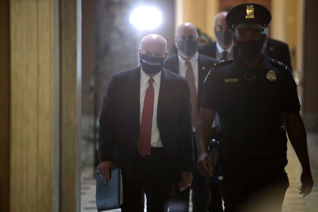 U.S. Postmaster General Louis Dejoy, who met with House Speaker Nancy Pelosi in August 5, is scheduled to testify before Congress on Aug. 21 and Aug. 24. (Alex Wong—Getty Images)
