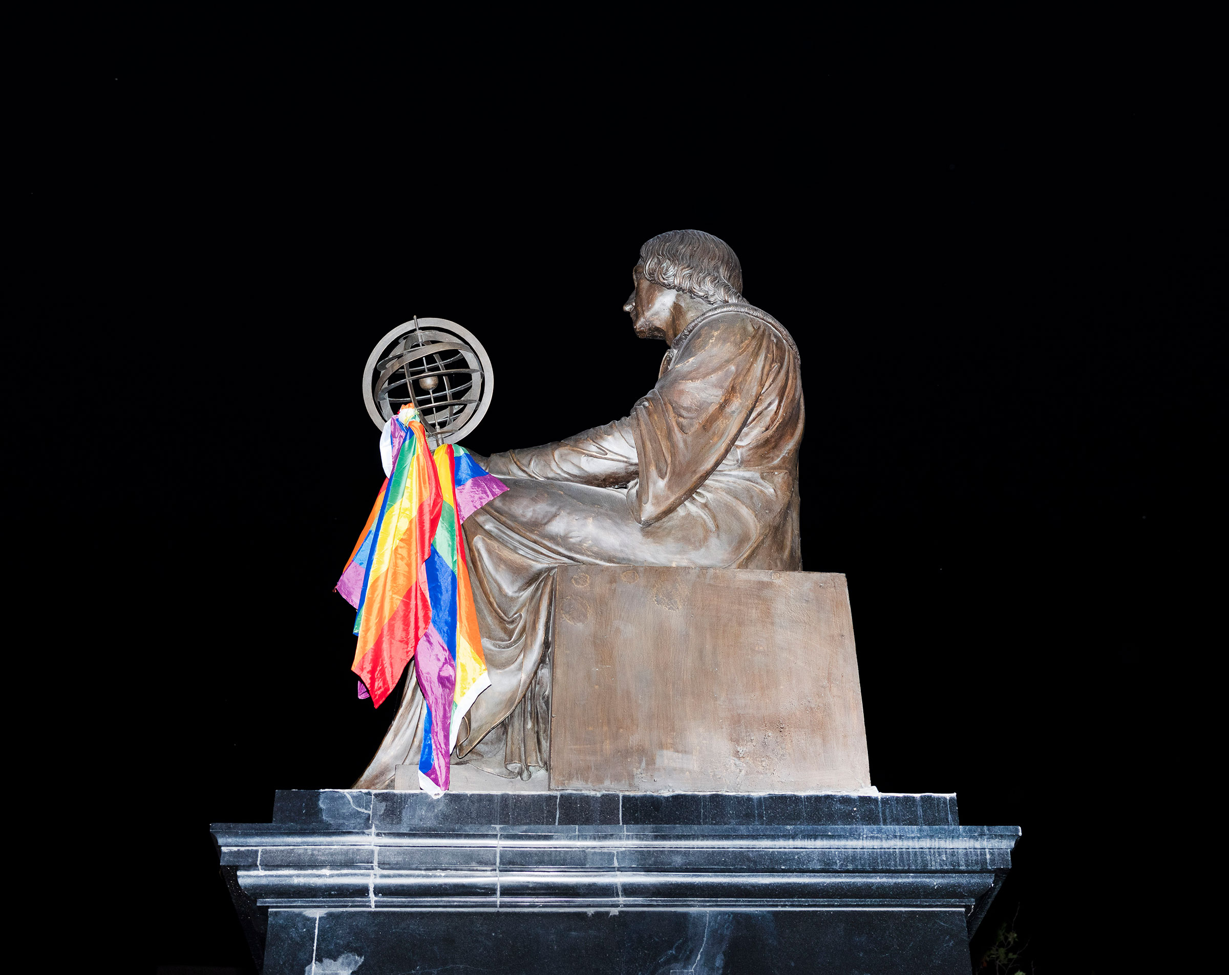 The Nicolaus Copernicus monument is decorated with rainbow flag