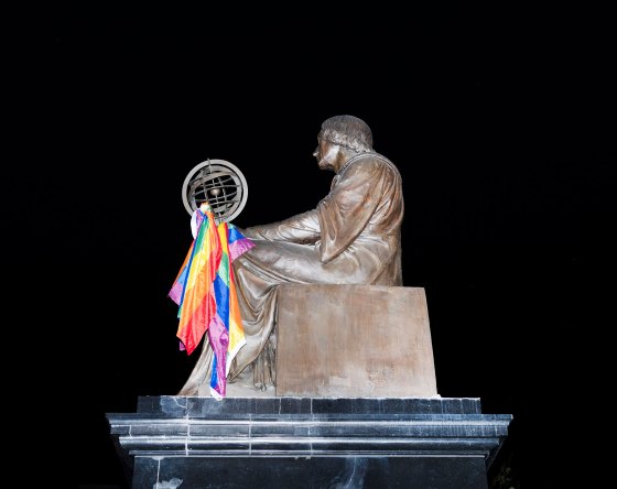 The Nicolaus Copernicus monument is decorated with rainbow flag