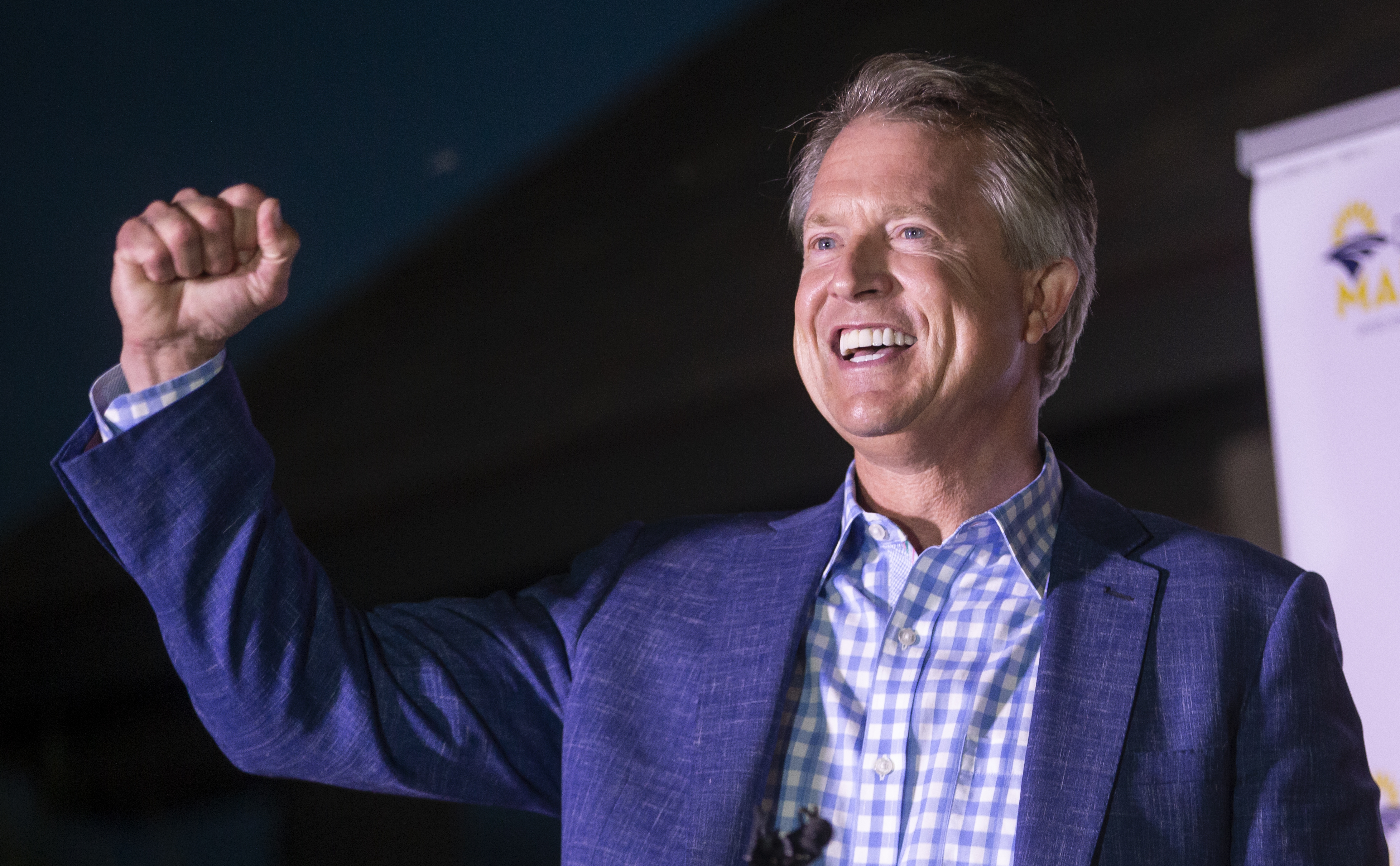 Roger Marshall pumps his fist after speaking to supporters near Pawnee Rock, Kan., Tuesday, Aug. 4, 2020, after defeating Kris Kobach in the Republican primary for U.S. Senate.