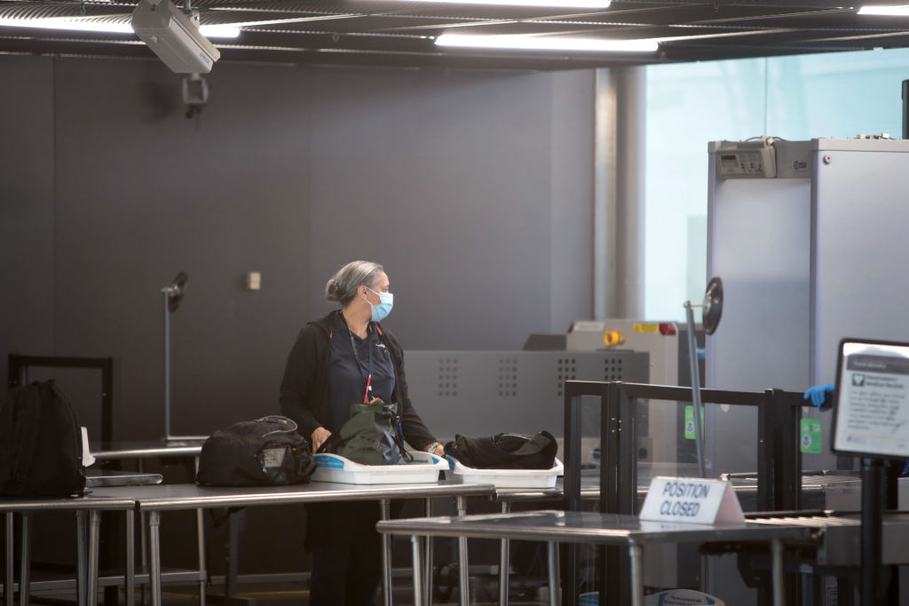 A worker goes through TSA screening at a nearly-deserted O'Hare International Airport on April 2, 2020 in Chicago, Illinois. (Scott Olson—Getty Images)