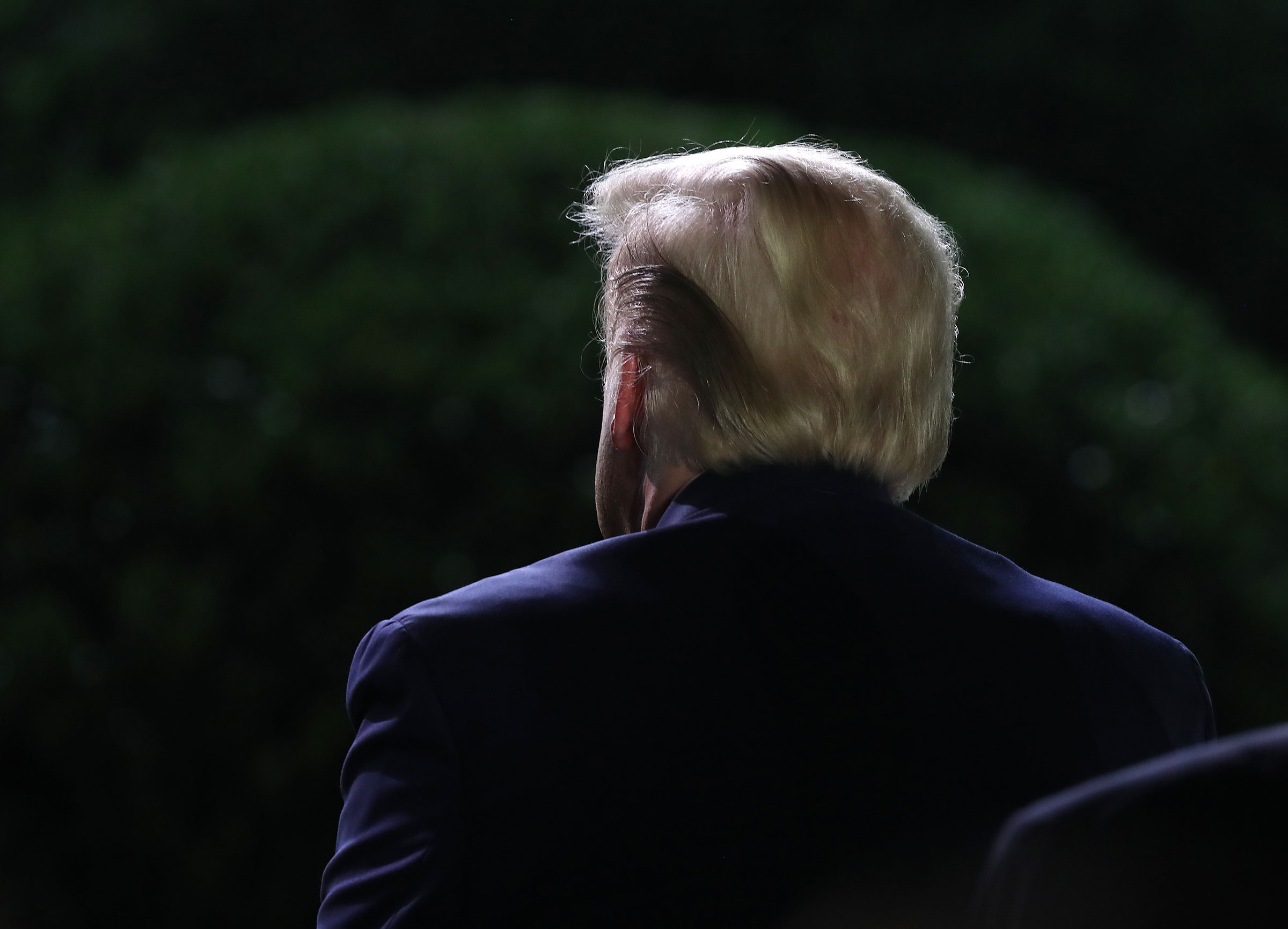 President Donald Trump listens as First Lady Melania Trump speaks during the Republican National Convention in the Rose Garden of the White House on Aug. 25, 2020. (Michael Reynolds—EPA/Bloomberg/Getty Images)