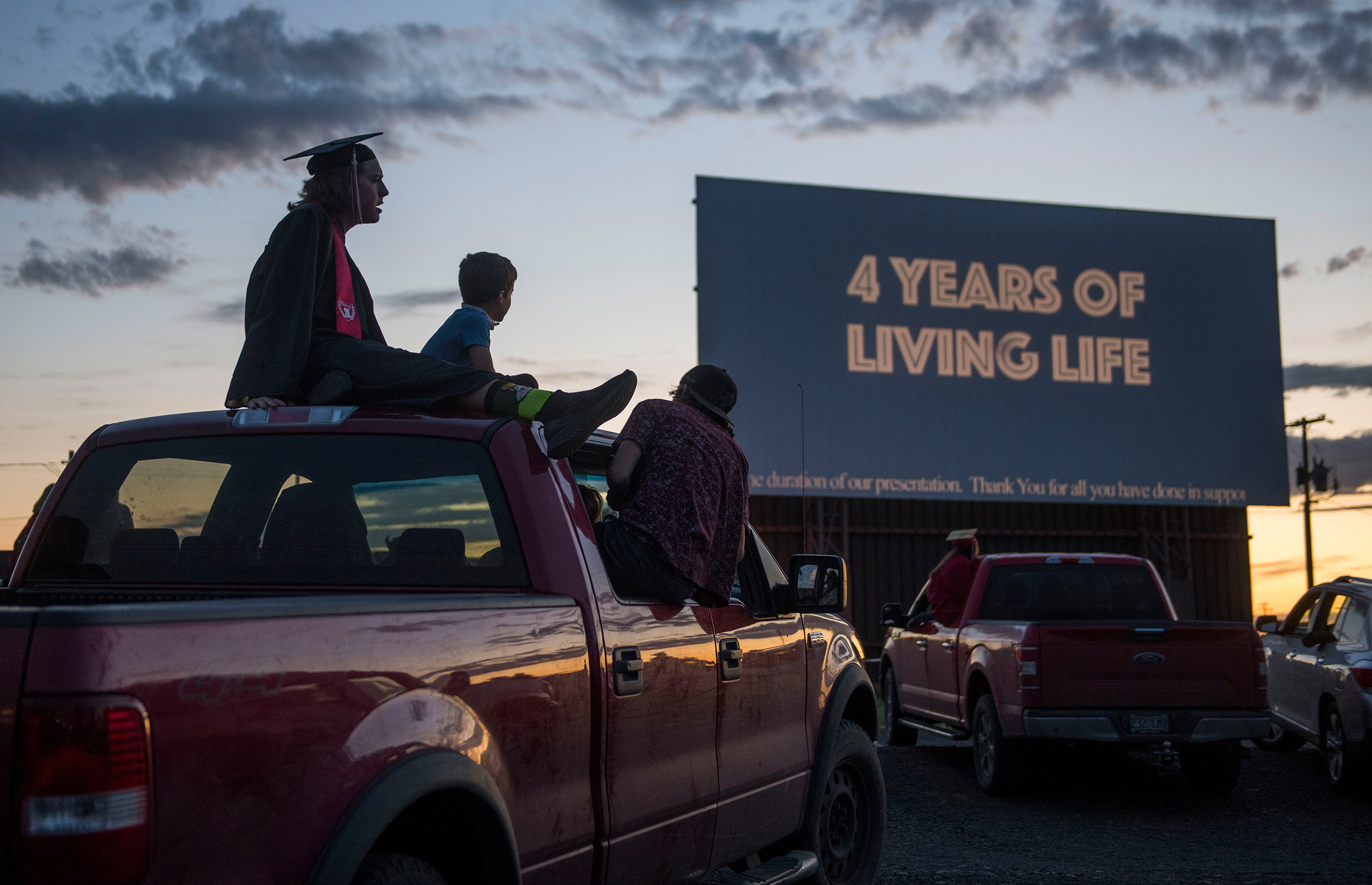 Cameron Curtindale, left, at a ceremony with Weston-McEwen High School classmates at the M-F Drive-In Theater in northern Oregon (Greg Lehman—Walla Walla Union-Bulletin/AP)