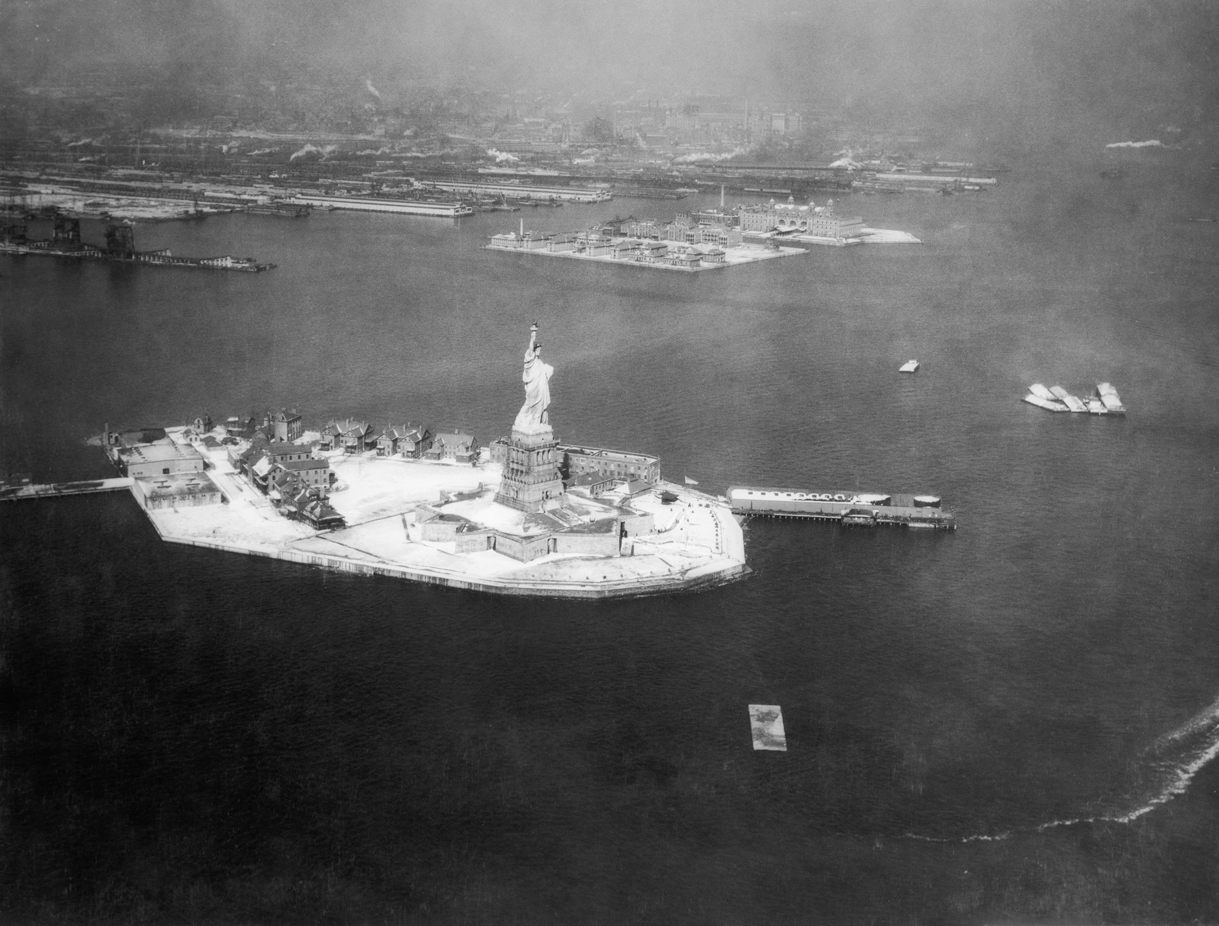 Aerial view of the Statue of Liberty, with Ellis Island in the background, date unknown. (George Rinhart—Corbis/Getty Images)
