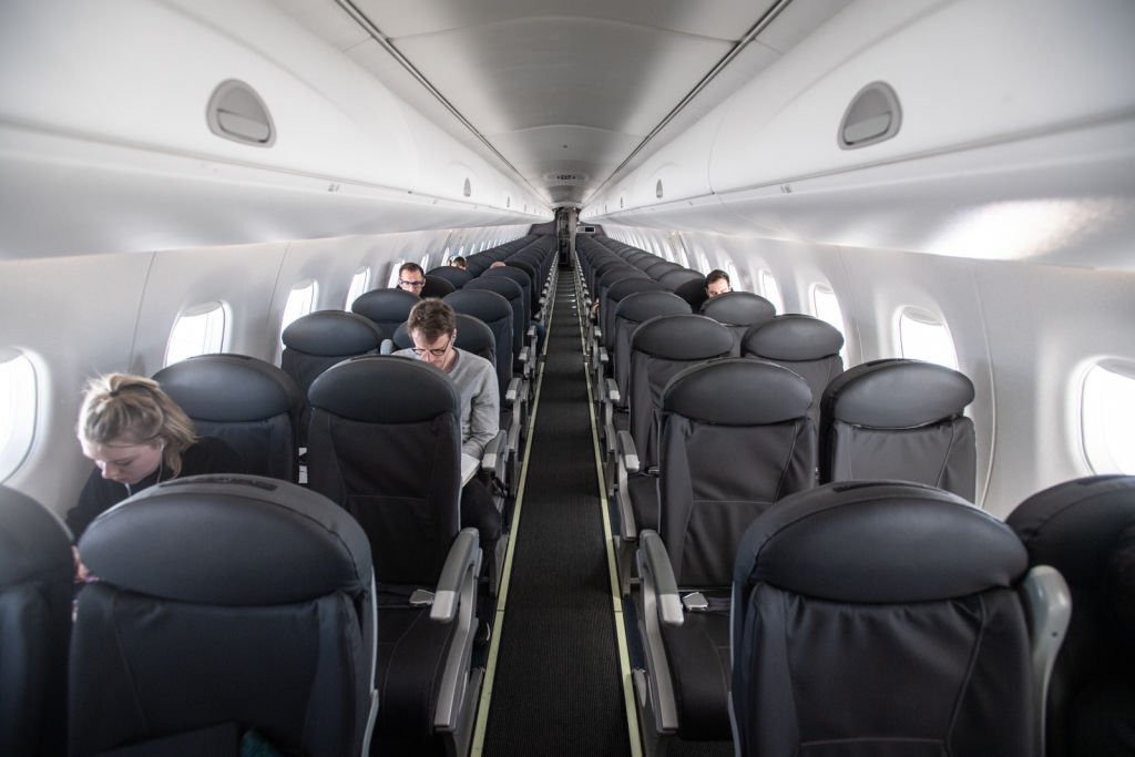 An almost empty British Airways passenger plane flies from Milan to London on March 5, 2020. (Laurel Chor&mdash; Getty Images)