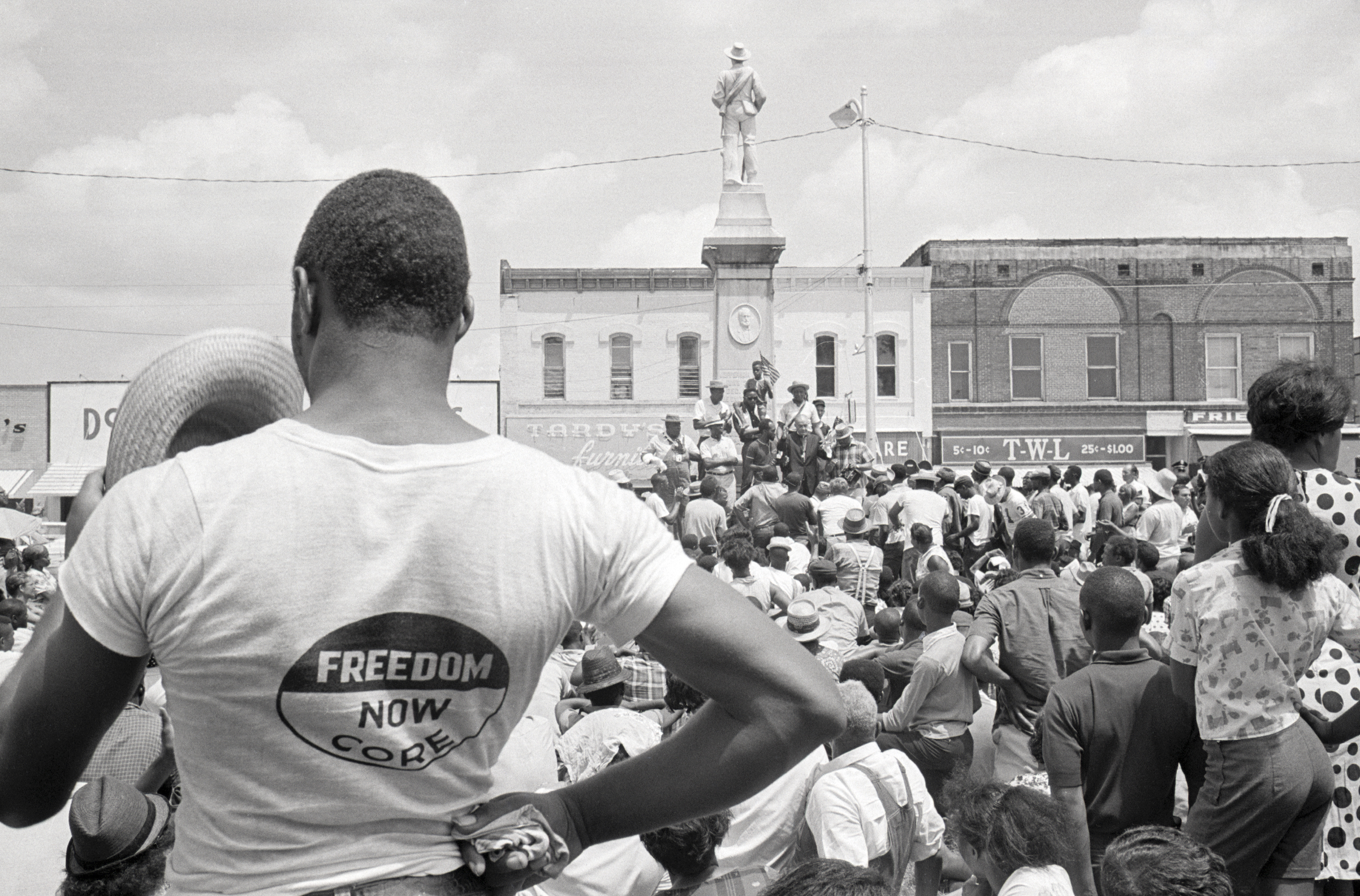 A marcher with "Freedom Now CORE" on his shirt joins in cheers of Mississippi Freedom march leaders assembled at the foot of a Civil War memorial statue in Grenada, Miss., in 1966. (Bettmann Archive/Getty Images)