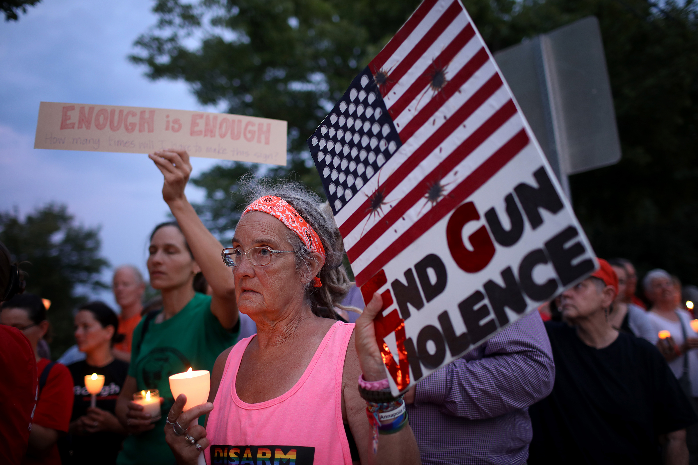 Advocates of gun reform hold a vigil for victims of mass shootings outside the headquarters of the National Rifle Association (NRA) on August 5, 2019 in Fairfax, Va. (Win McNamee—Getty Images)