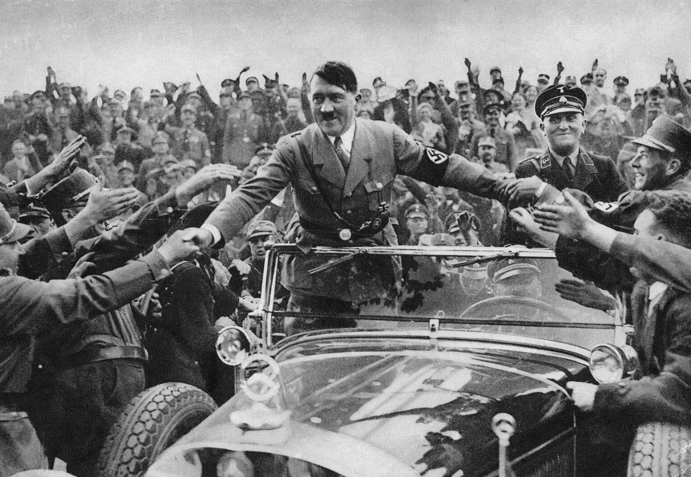 Adolf Hitler is welcomed by supporters at Nuremberg in 1933 (Getty Images)