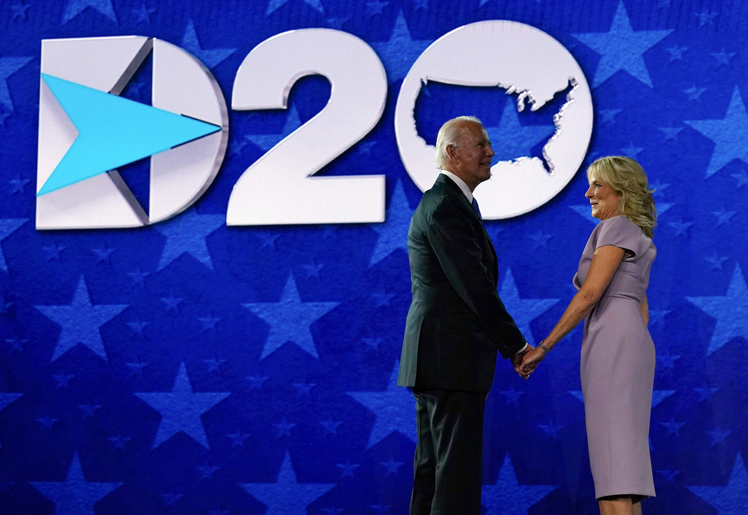 Former vice-president and Democratic presidential nominee Joe Biden and his wife Jill Biden stand on stage after he accepted the Democratic Party nomination for US president during the last day of the Democratic National Convention, being held virtually amid the novel coronavirus pandemic, at the Chase Center in Wilmington, Delaware on Aug. 20, 2020. (Olivier Douliery—AFP/Getty Images)