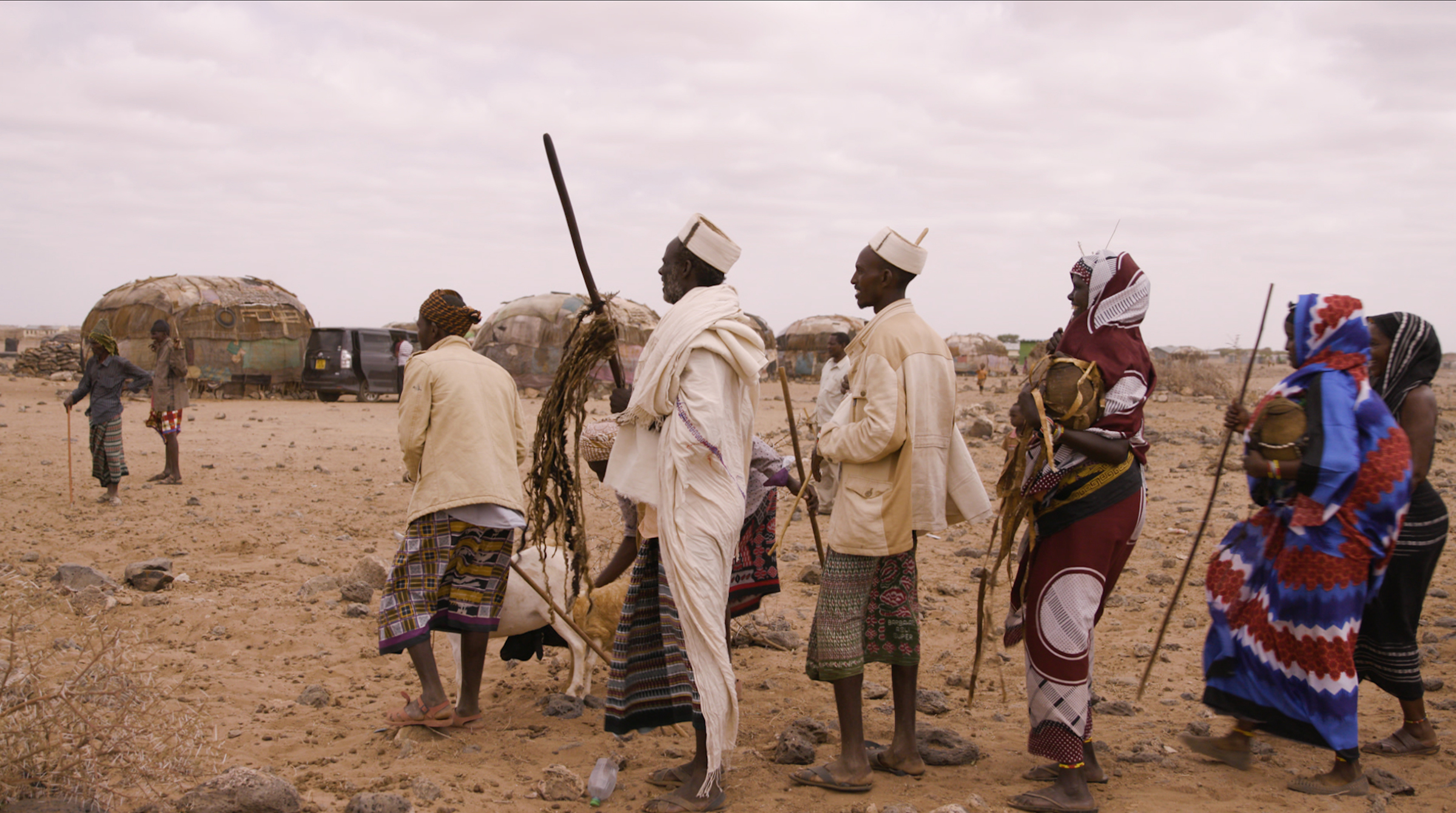 This frame grab from a video taken for TIME on 14 March 2020, shows men with the gifts on the day before the weddin. The groom's family presents gifts to the bride's father, including a dowry of three camels, a moila camel packed with gifts. There are also gifts to the bride’s family that include milk, tobacco and coffee beans.