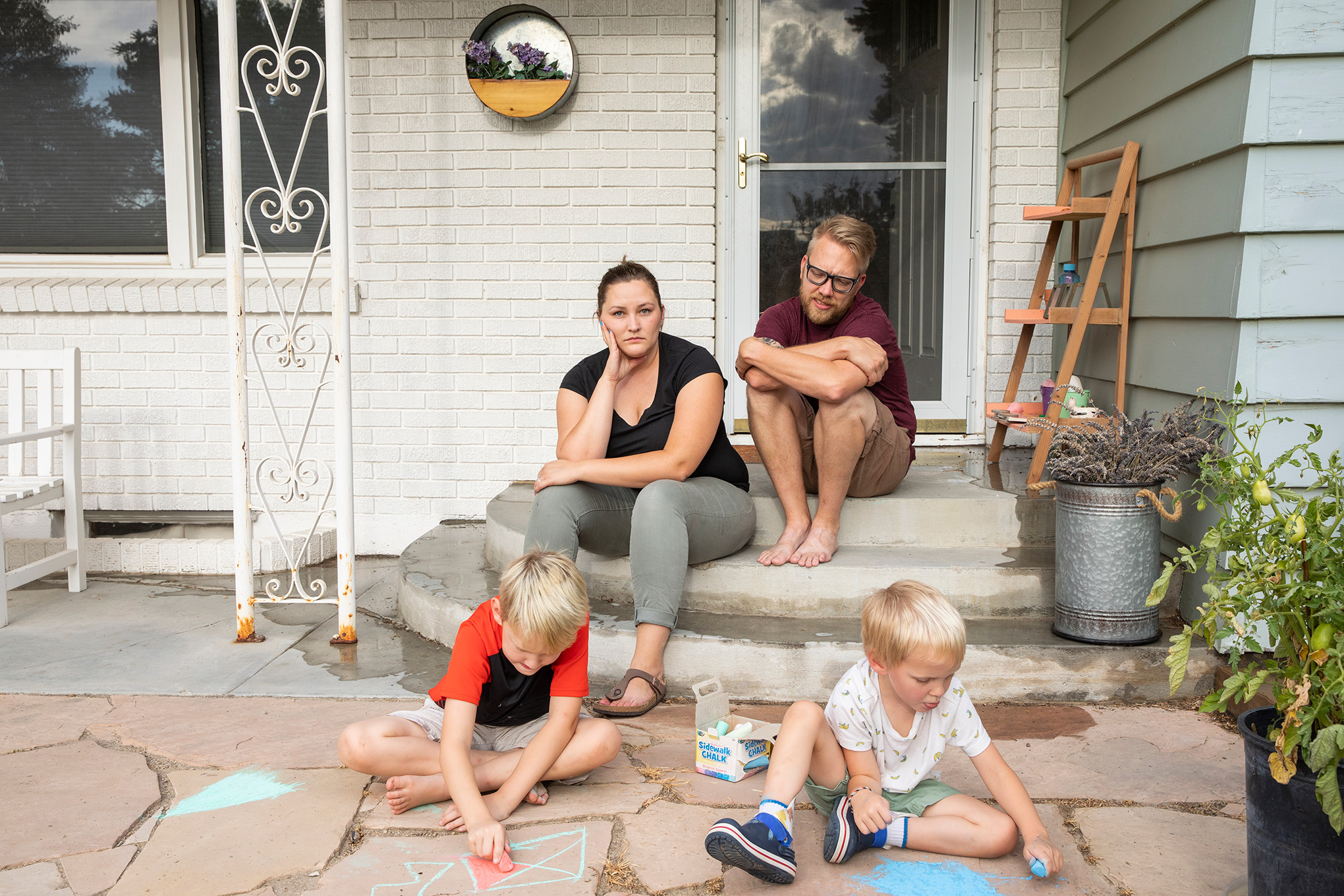 Kayla Brim with her family, outside their home in Caldwell, Idaho, on Aug. 11. Brim has been sick with COVID-19 since early July. (Angie Smith for TIME)