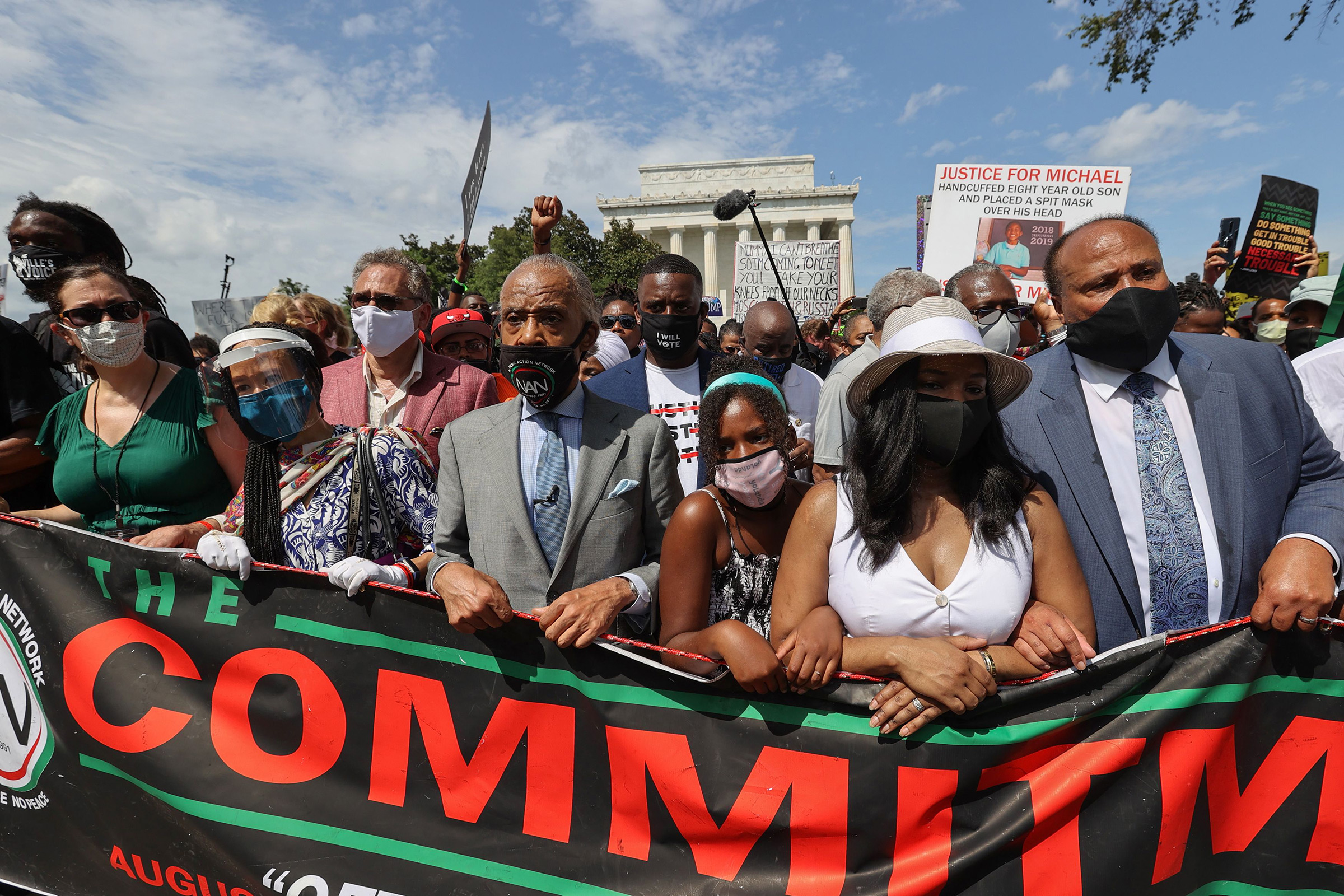 Rev. Al Sharpton, center, marches next to Yolanda King, Andrea Waters King and Martin Luther King, III during the "Commitment March: Get Your Knee Off Our Necks" protest against racism and police brutality, in Washington, D.C., on Aug. 28, 2020.