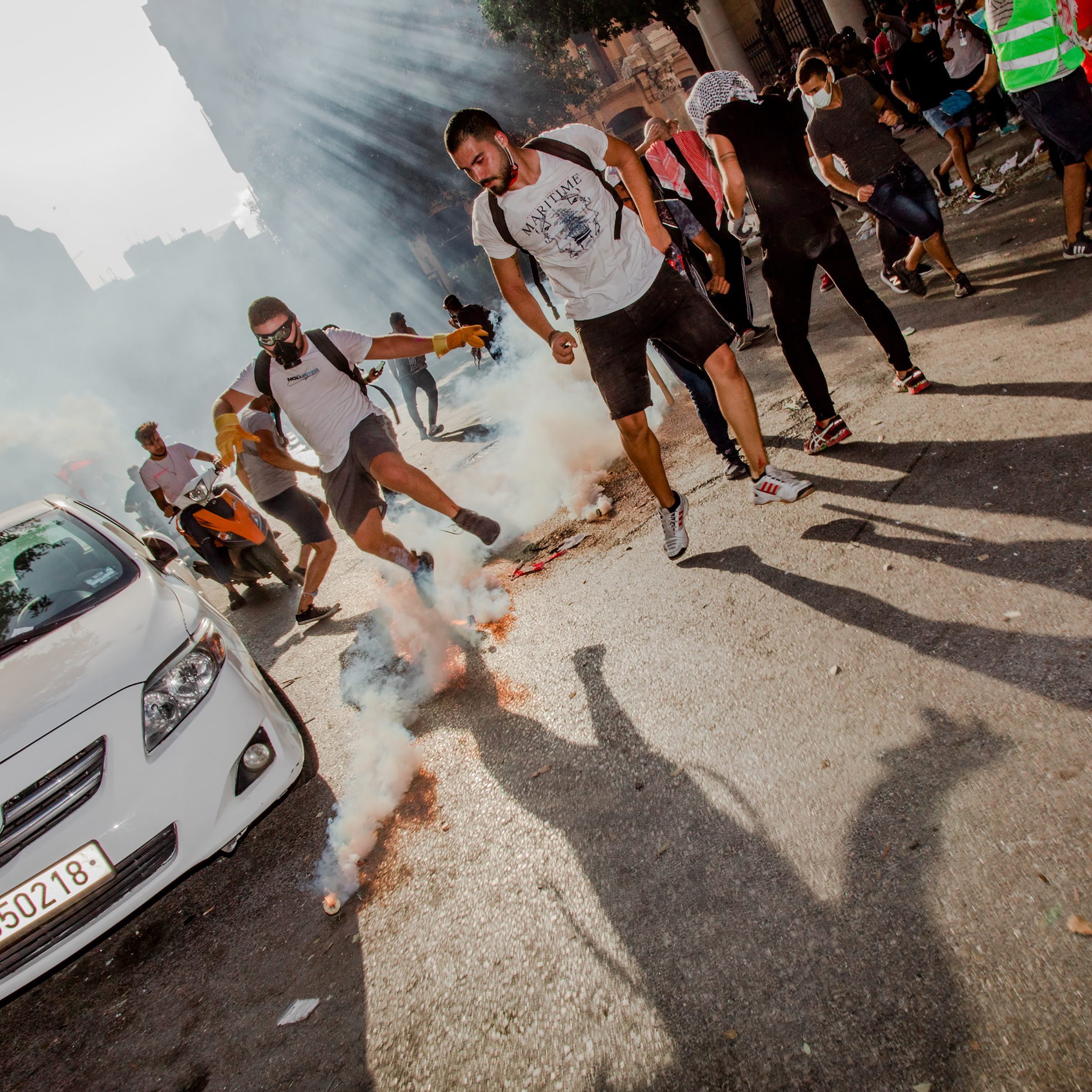 Smoke billows from a tear gas canister during a mass demonstration in Beirut on Aug. 8, four days after the blast.