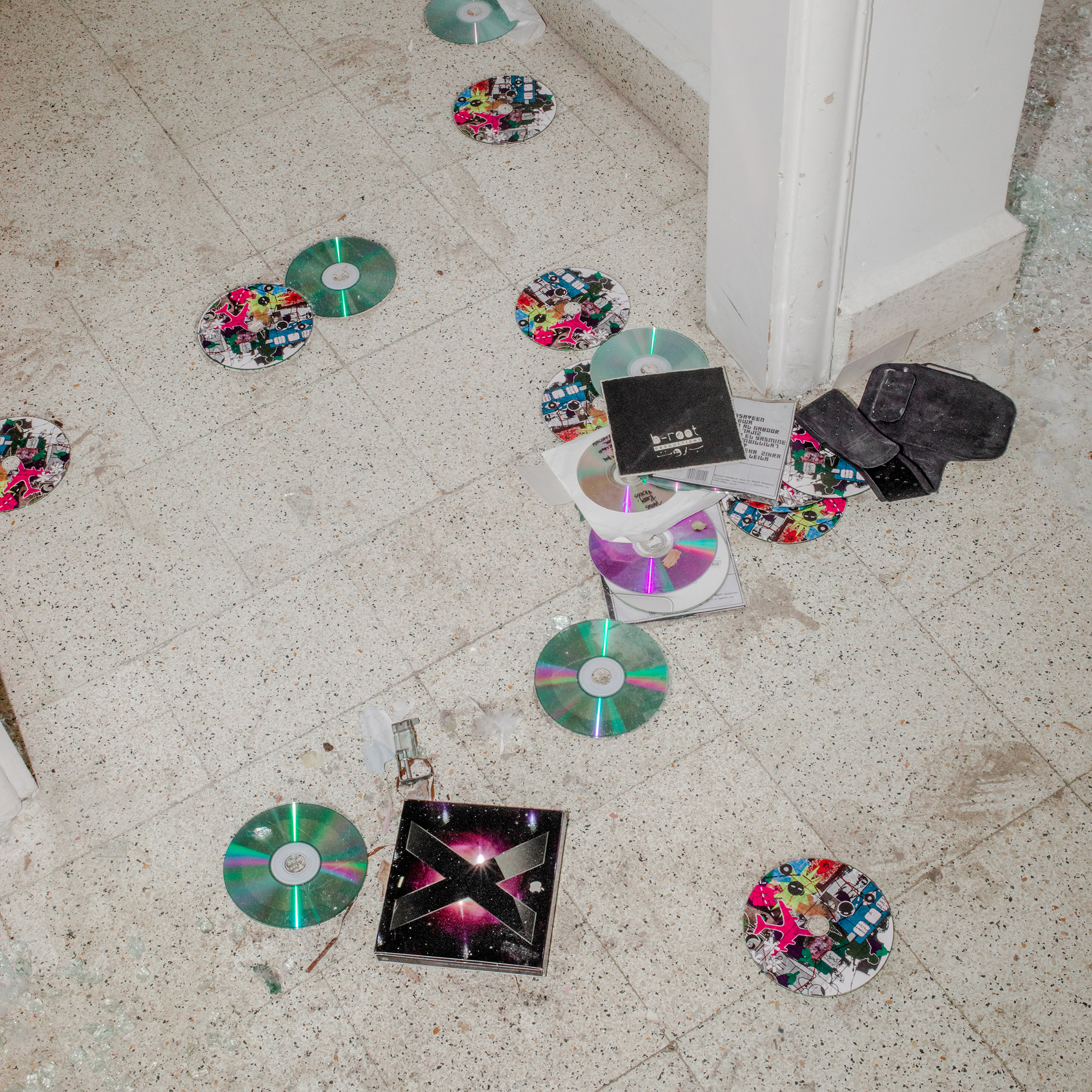 CDs are scattered on the floor of music producer Jana Saleh's apartment, which was heavily damaged by the port explosion and blast wave. 
