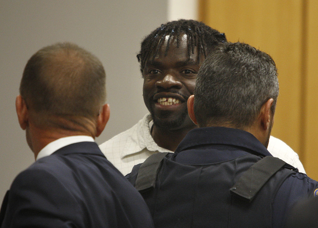 Death row inmate Marcus Robinson smiles toward his family after a judge found that racial bias played a role in his  sentencing on April 20, 2012, in Fayetteville, North Carolina. (Shawn Rocco—Raleigh News&amp; Observer/Getty Images)
