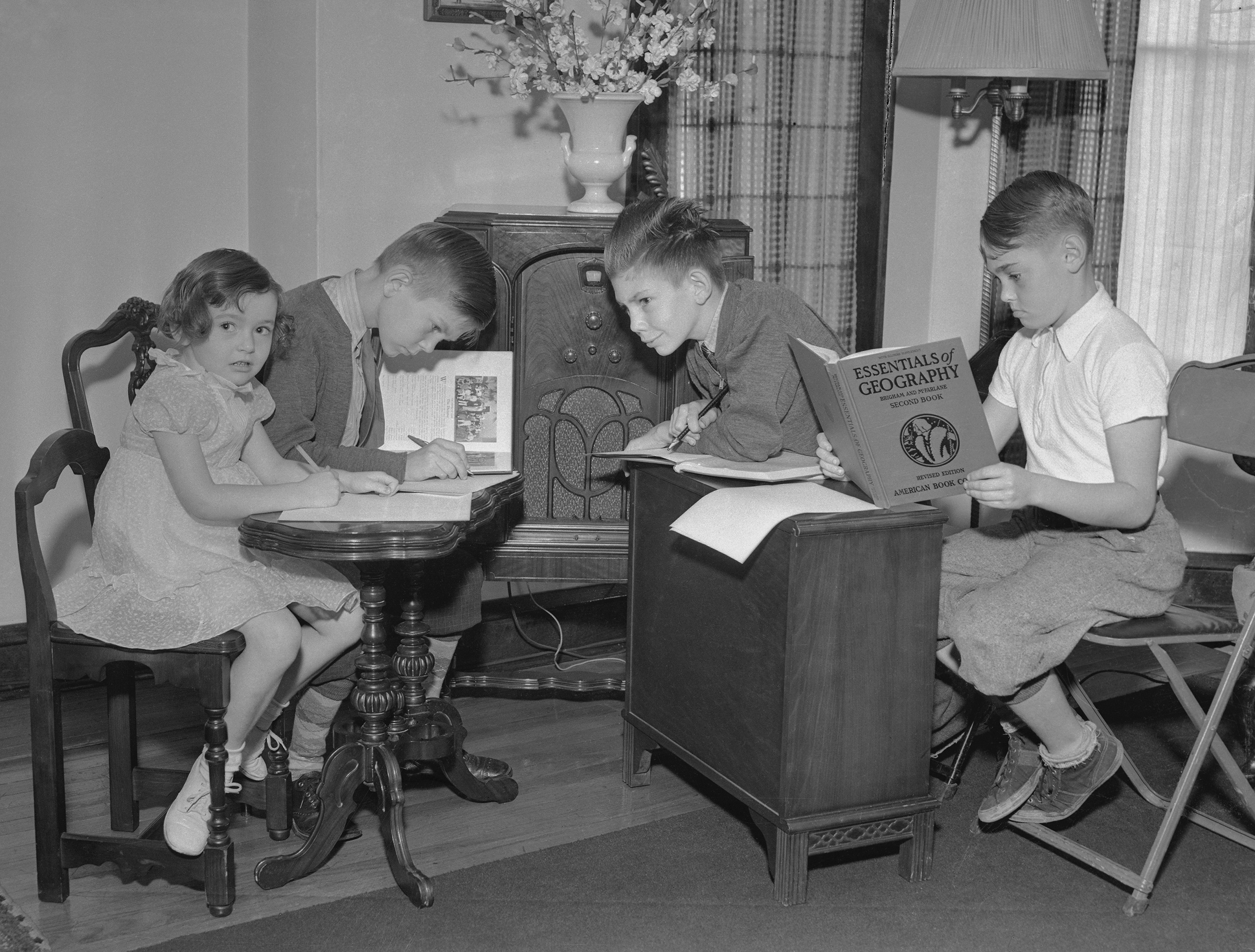 Due to the Infantile Paralysis Epidemic in Chicago, the reopening of schools was delayed. Students listen to a pre-arranged course of study via the radio stations, in accordance with a schedule drawn up by several school principals, on Sept 13, 1937