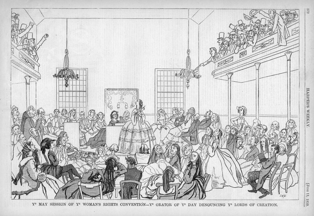 A circa 1859 <i>Harper's Weekly</i> caricature satirizing the 1848 women's rights Convention in Seneca Falls, New York, captioned "Ye May Session of Ye Woman's Rights Convention - ye orator of ye day denouncing ye lords of creation, " suggesting that suffrage is contrary to religious and natural law. (Ken Florey Suffrage Collection/Gado—Getty Images)