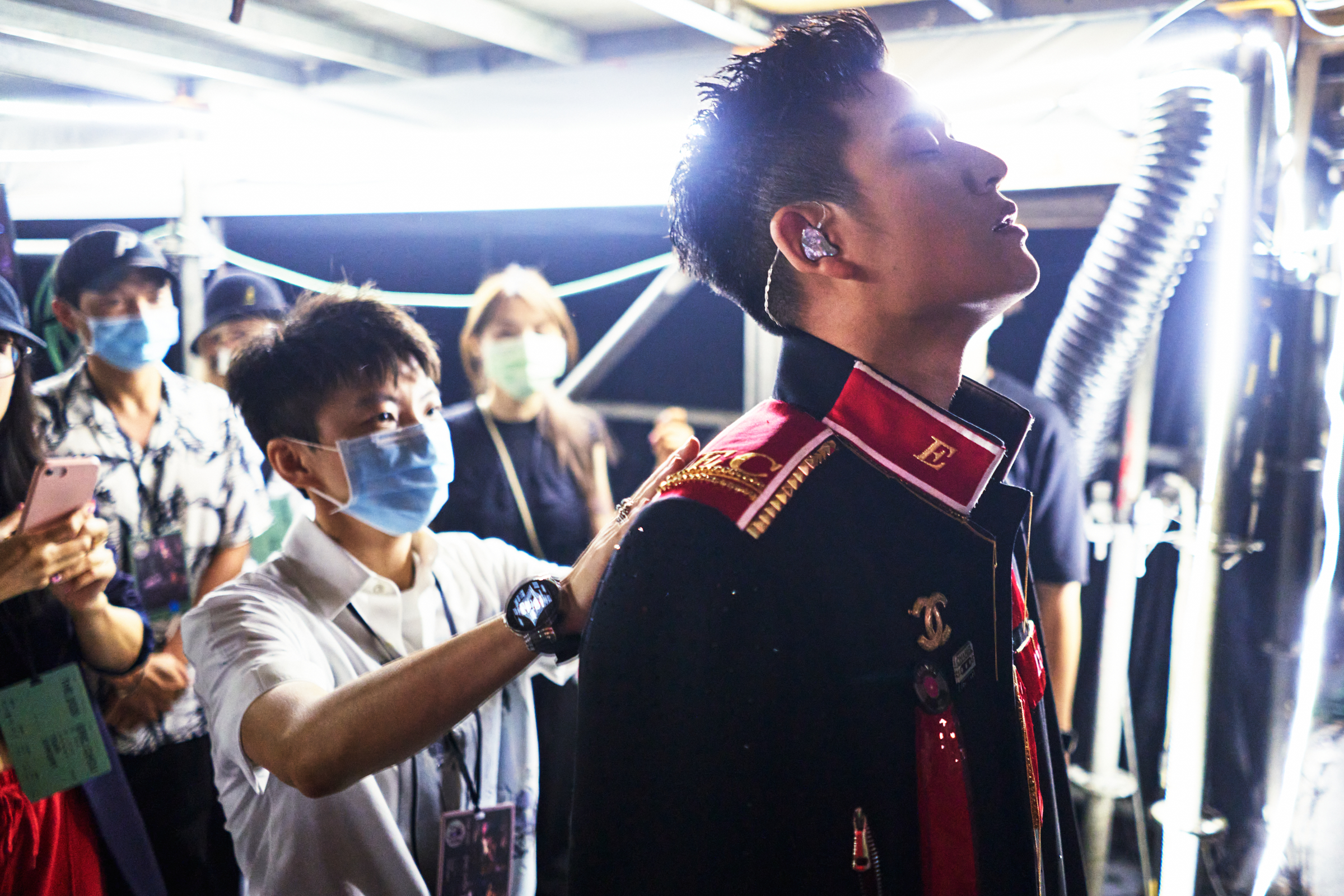 Chou receives finishing touches from his manager Reese Hsu before going onstage to perform for more than 10,000 fans