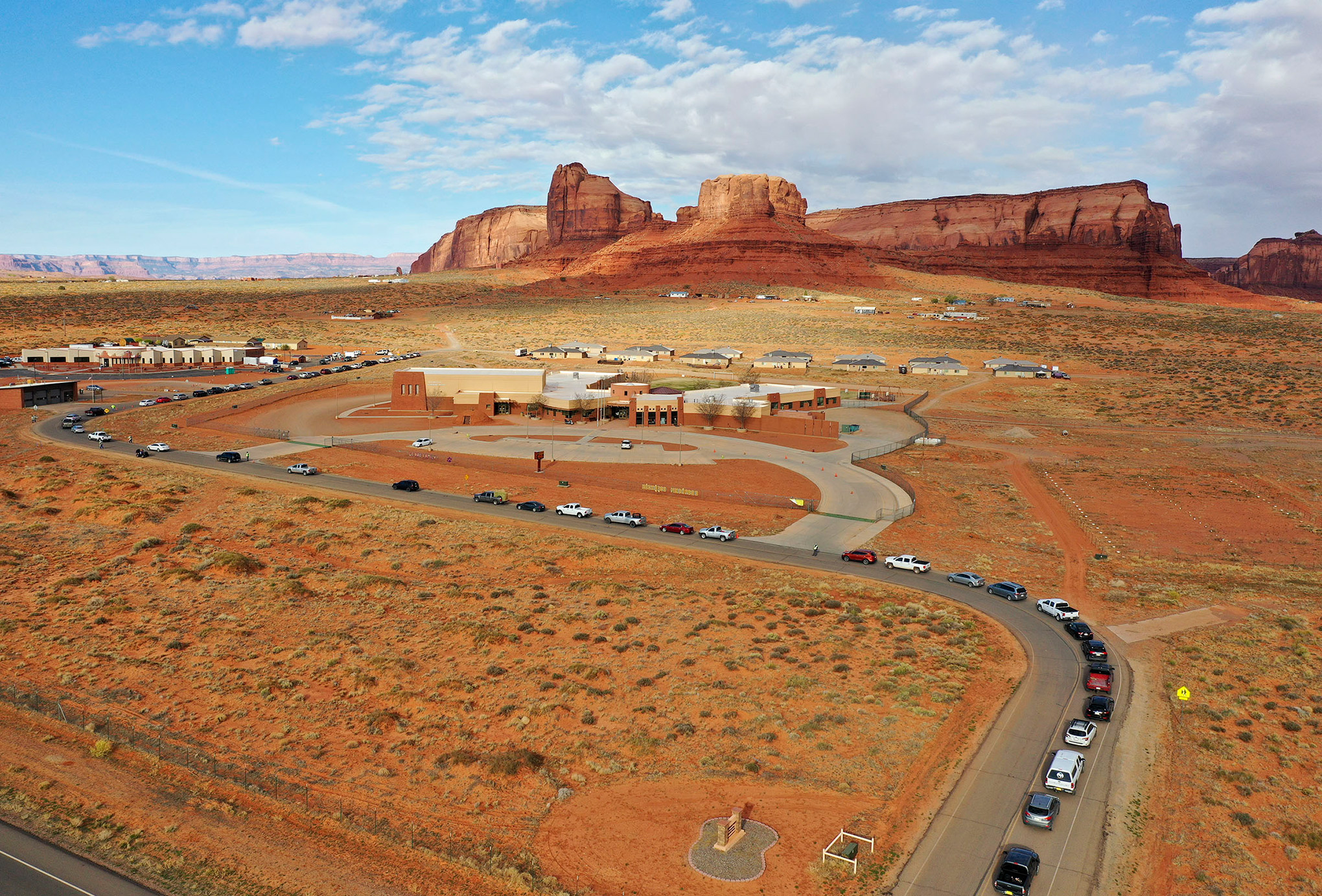 Vehicles line up for testing outside of the Monument Valley Health Center in Oljato-Monument Valley, Utah, on Apr. 17, 2020.