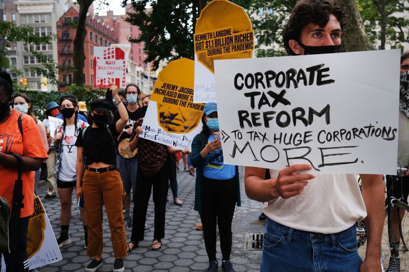 People participate in a  March on Billionaires  event on July 17 in New York City. The march called on Governor Andrew Cuomo to pass a tax on billionaires and to fund workers excluded from unemployment and federal aid programs