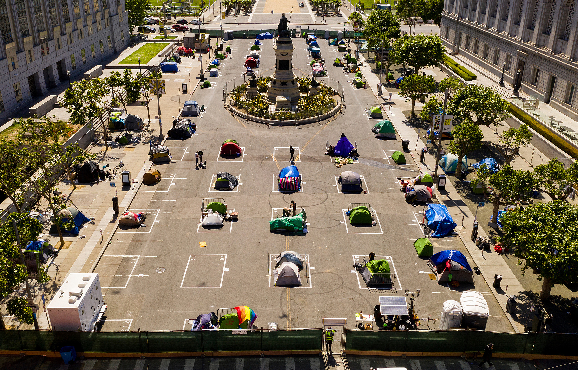 Rectangles designed to help prevent the spread of the coronavirus by encouraging social distancing line a city-sanctioned homeless encampment at San Francisco's Civic Center on May 21