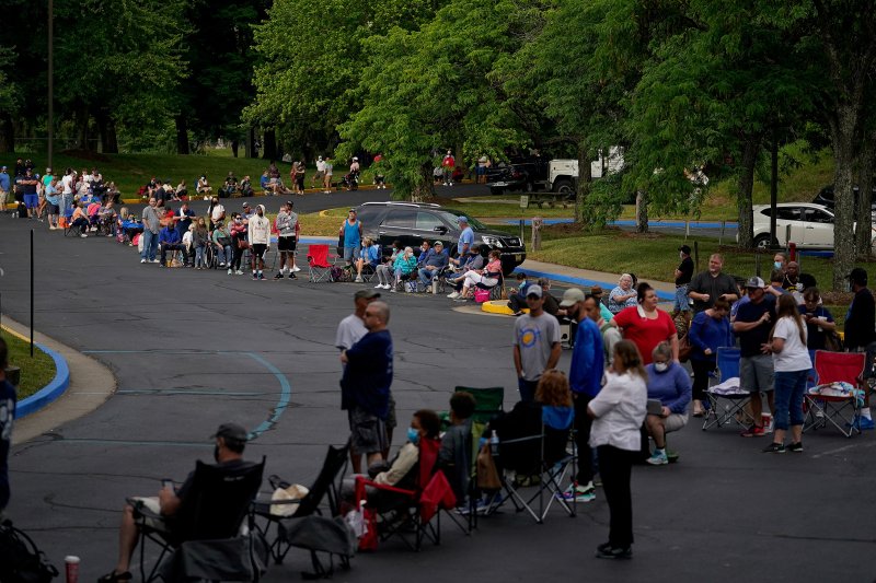 People line up outside Kentucky Career Center to find assistance with their unemployment claims in Frankfort, Kentucky, U.S. June 18